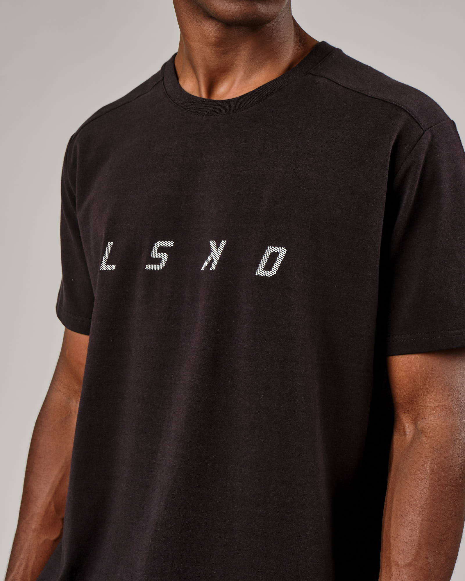 Model wearing Grid Tee - Black