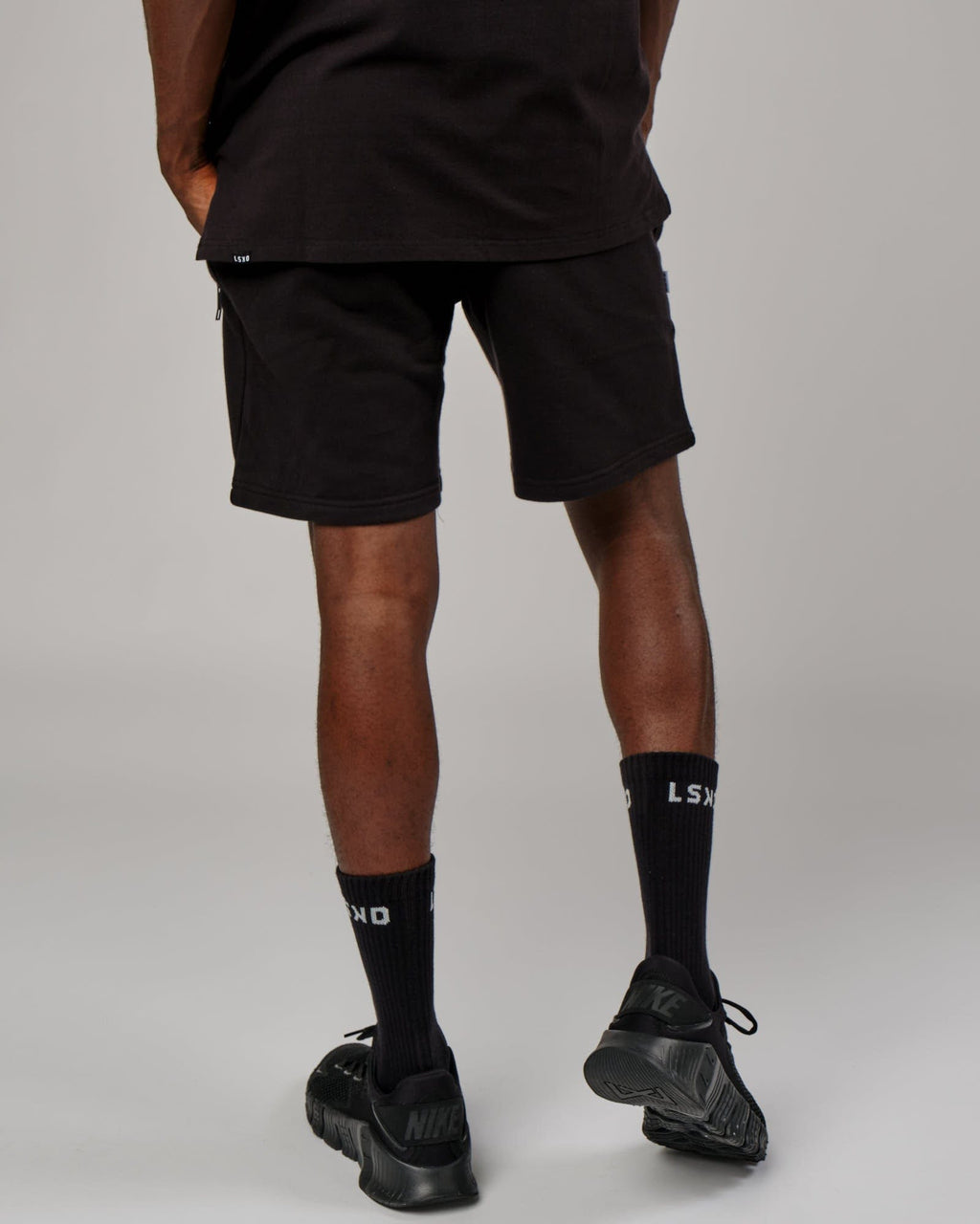 Model wearing Connor Track Short - Black