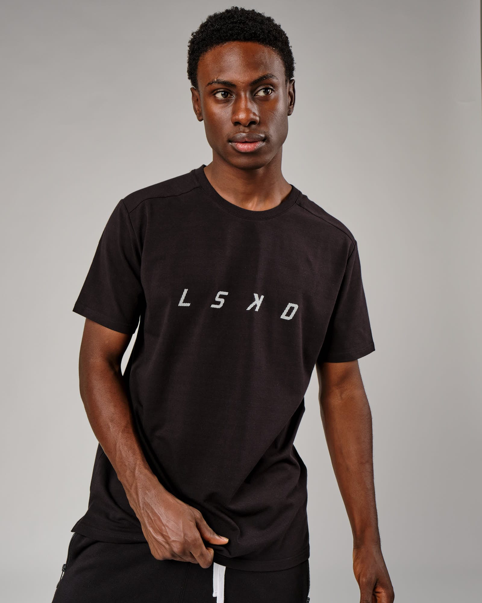 Model wearing Grid Tee - Black
