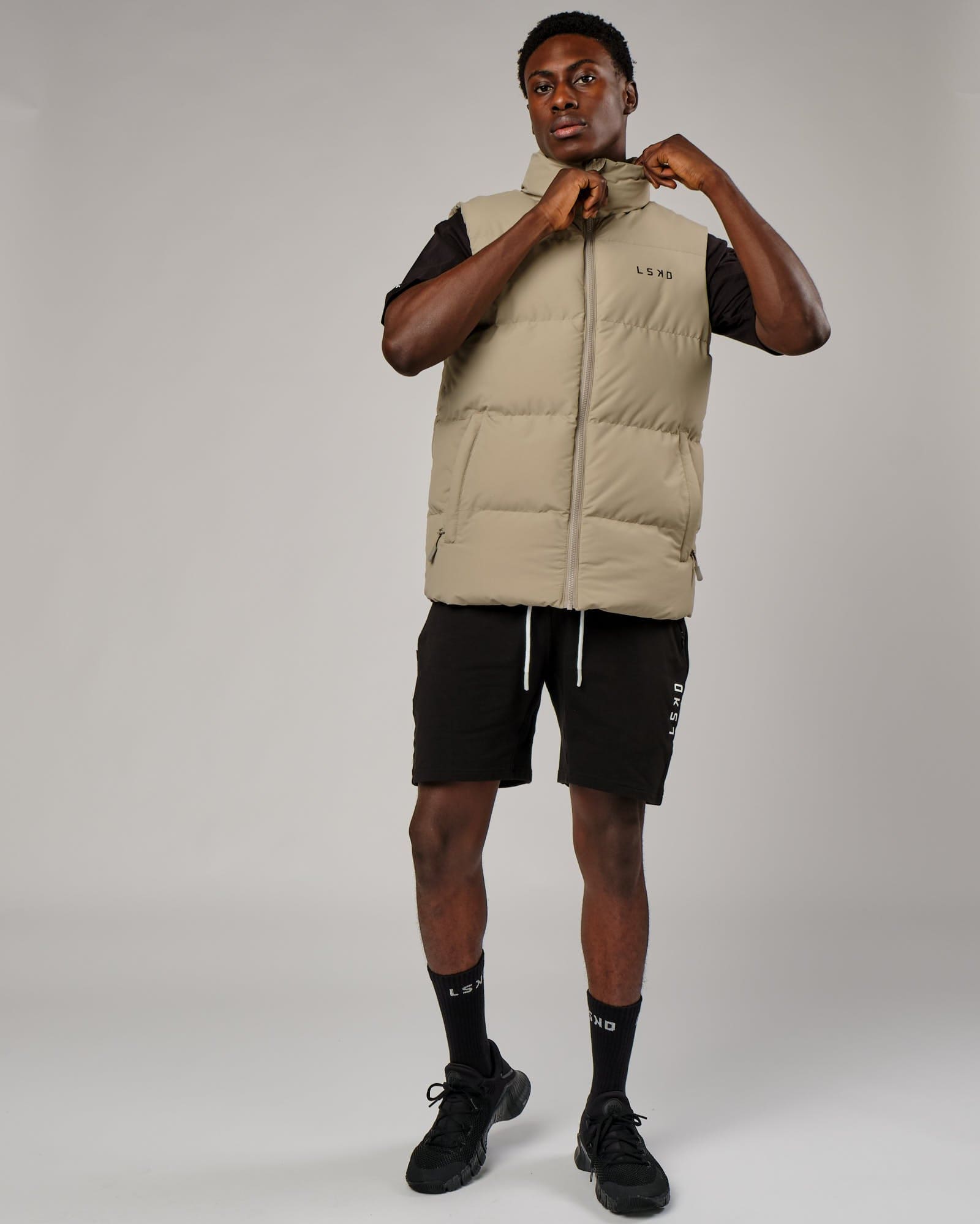Model wearing Essential Puffer Vest - Laurel Oak