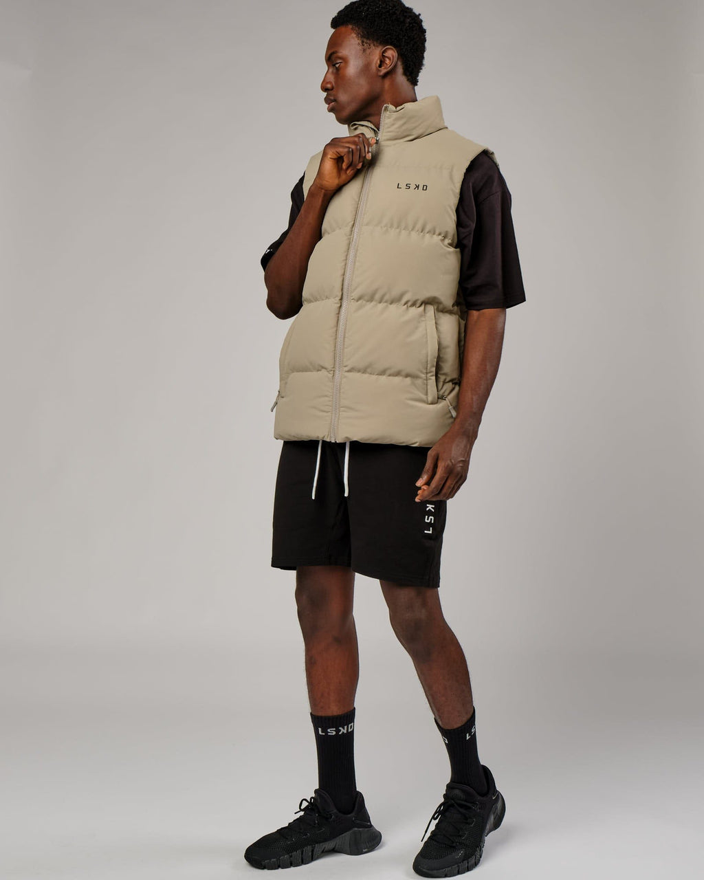 Model wearing Essential Puffer Vest - Laurel Oak