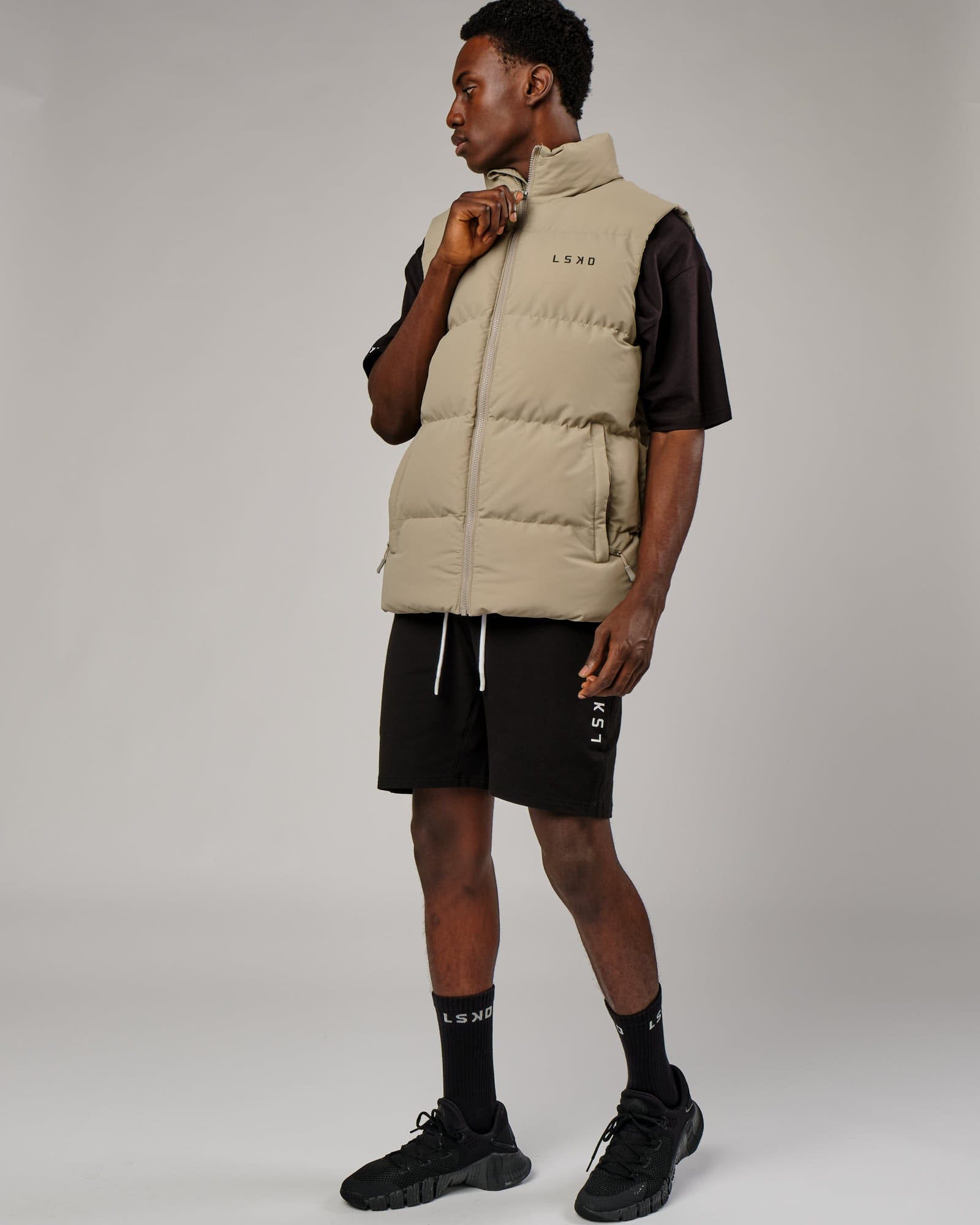 Model wearing Essential Puffer Vest - Laurel Oak