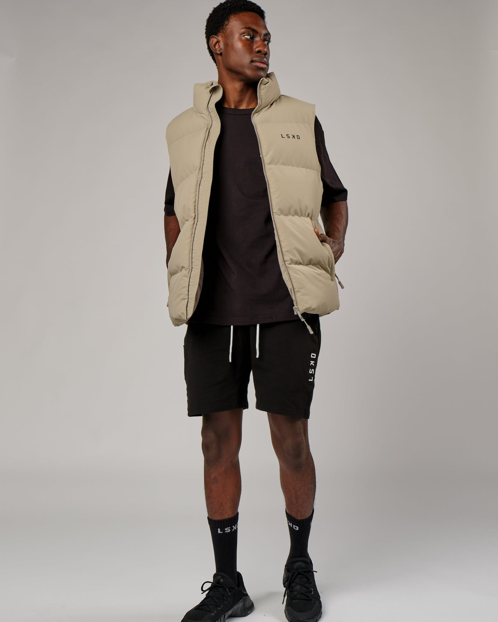 Model wearing Essential Puffer Vest - Laurel Oak