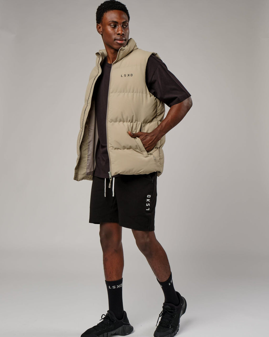 Model wearing Essential Puffer Vest - Laurel Oak