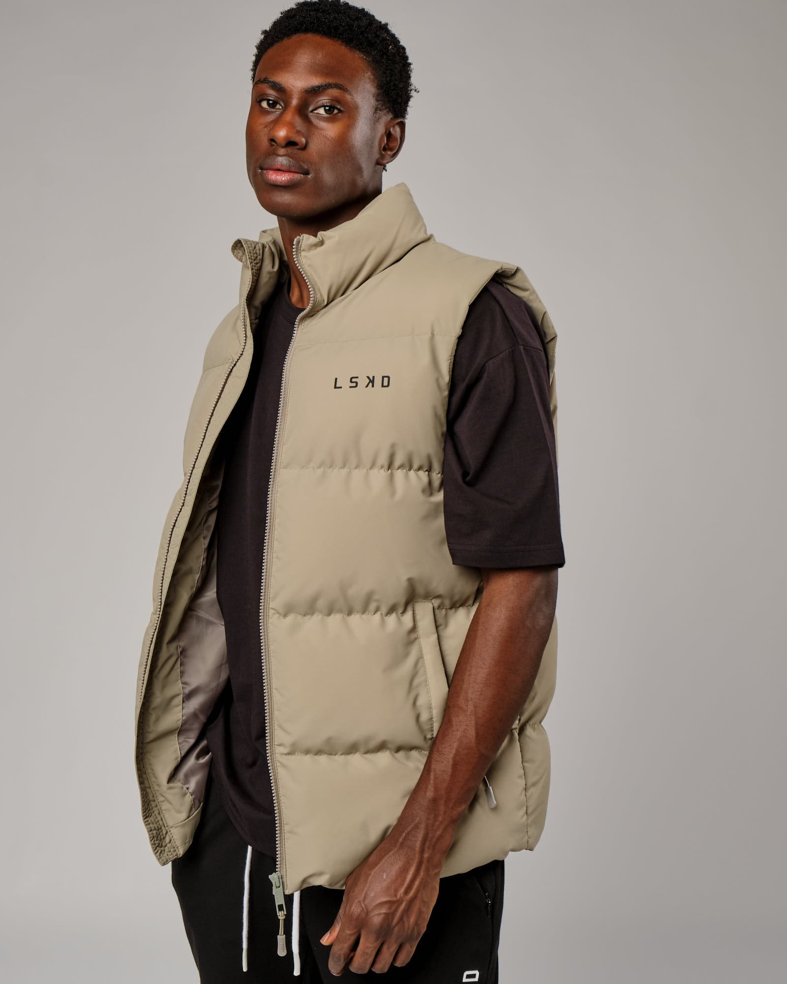 Model wearing Essential Puffer Vest - Laurel Oak