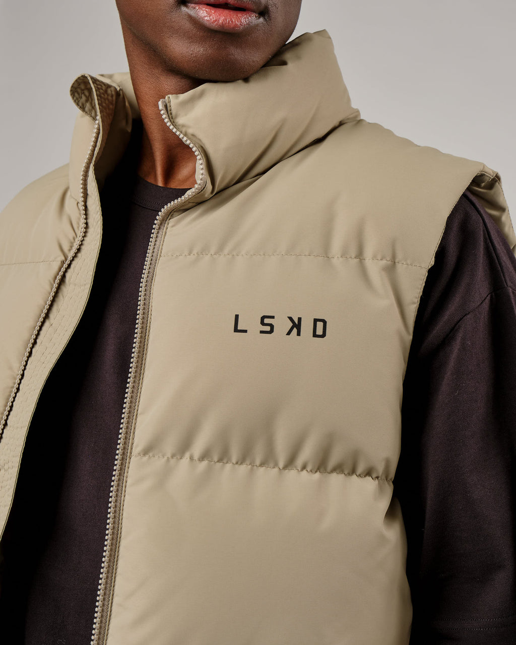 Model wearing Essential Puffer Vest - Laurel Oak