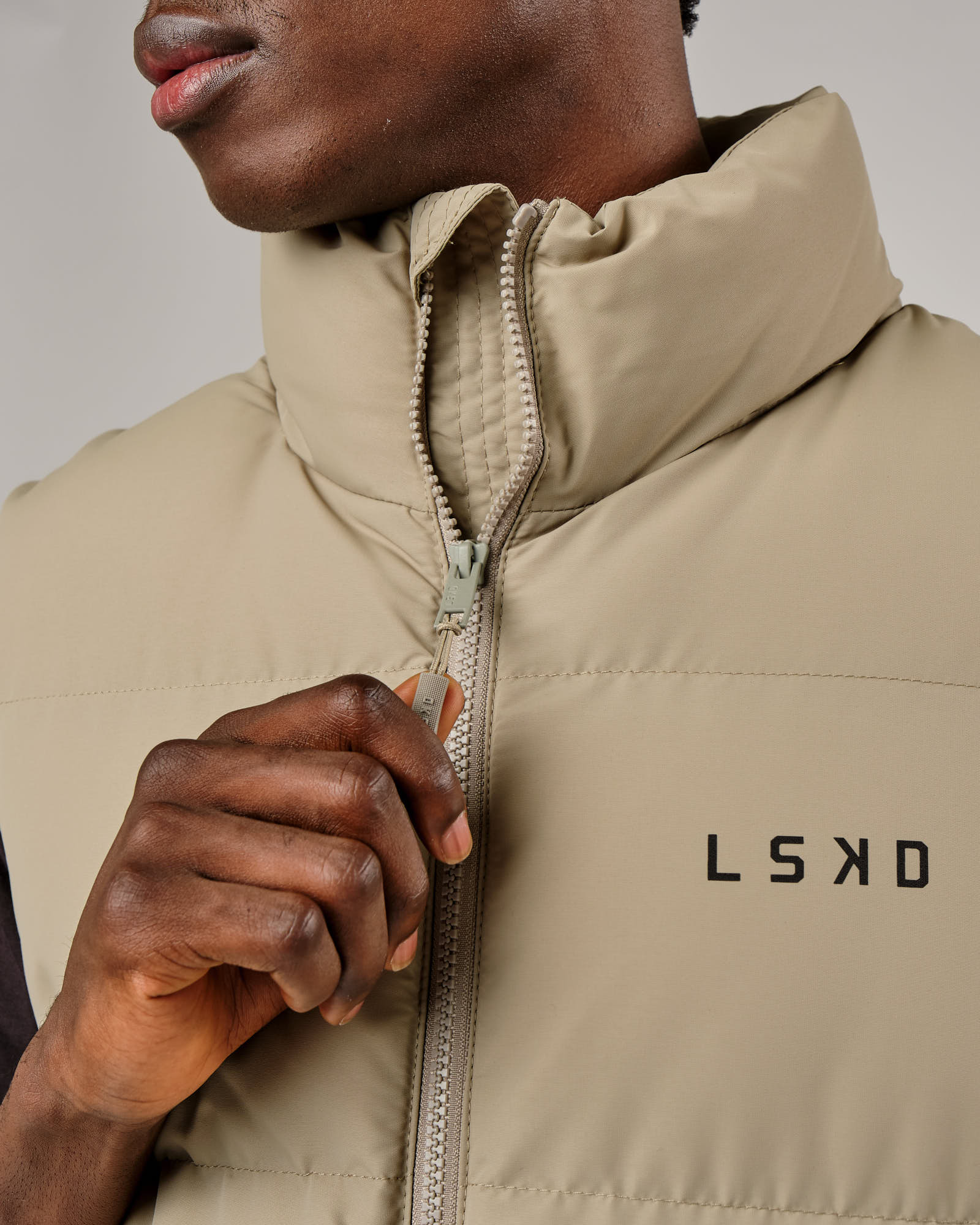 Model wearing Essential Puffer Vest - Laurel Oak