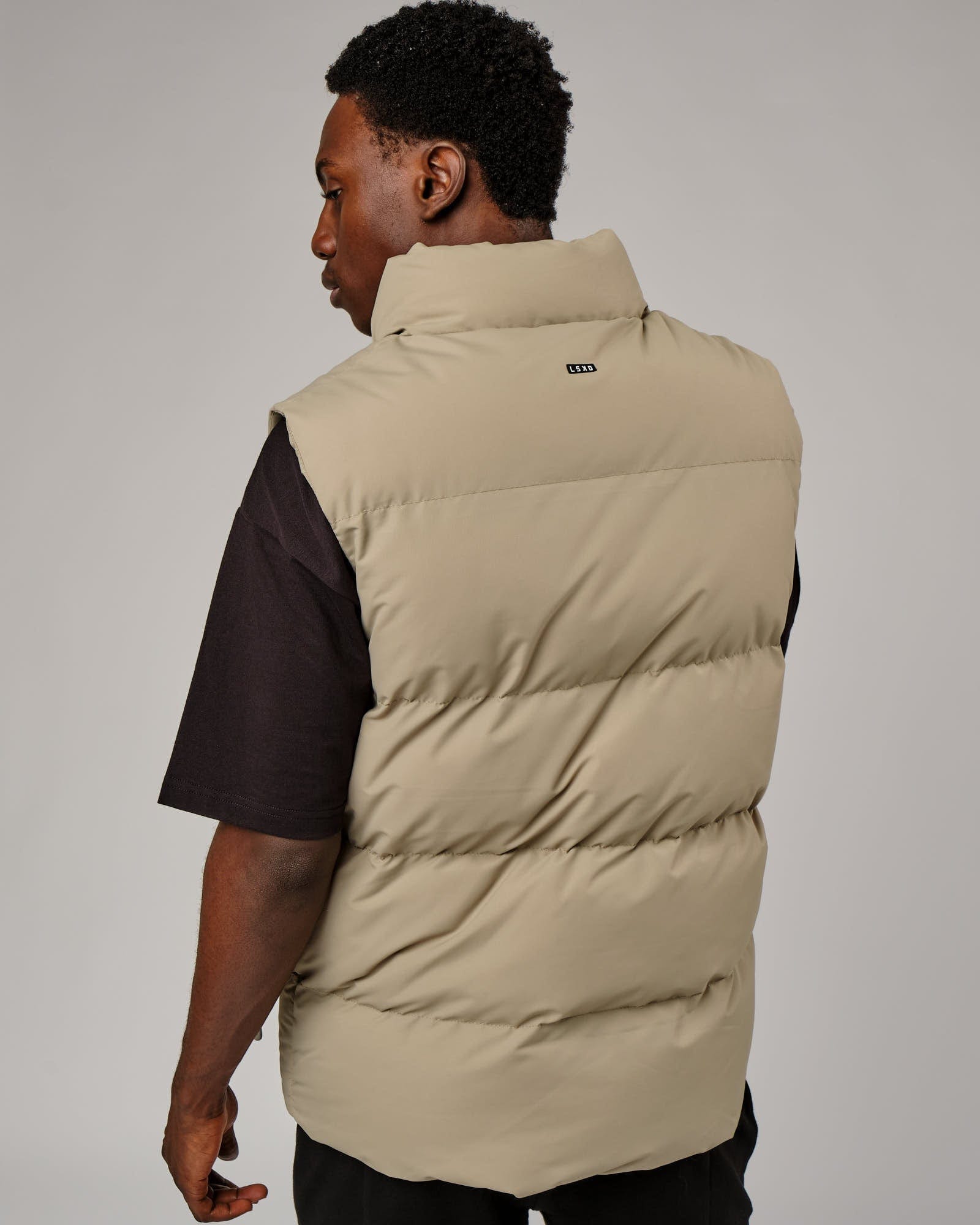 Model wearing Essential Puffer Vest - Laurel Oak