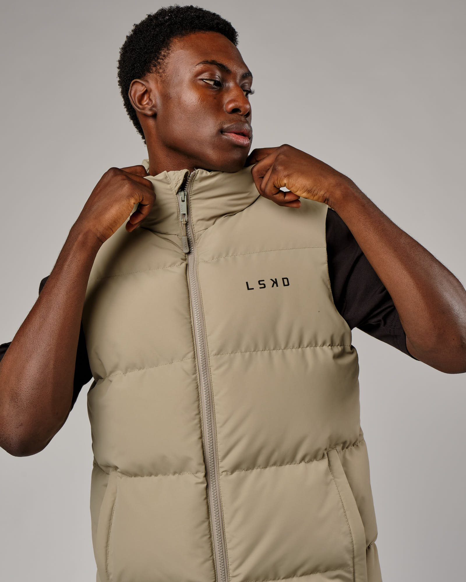 Model wearing Essential Puffer Vest - Laurel Oak