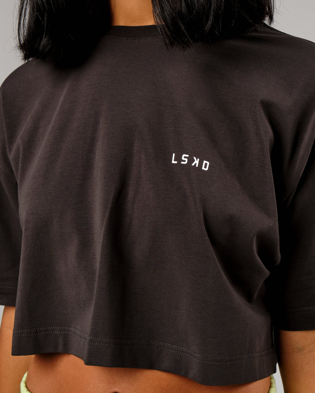 Model wearing Tilt Cropped Tee - Pirate Black