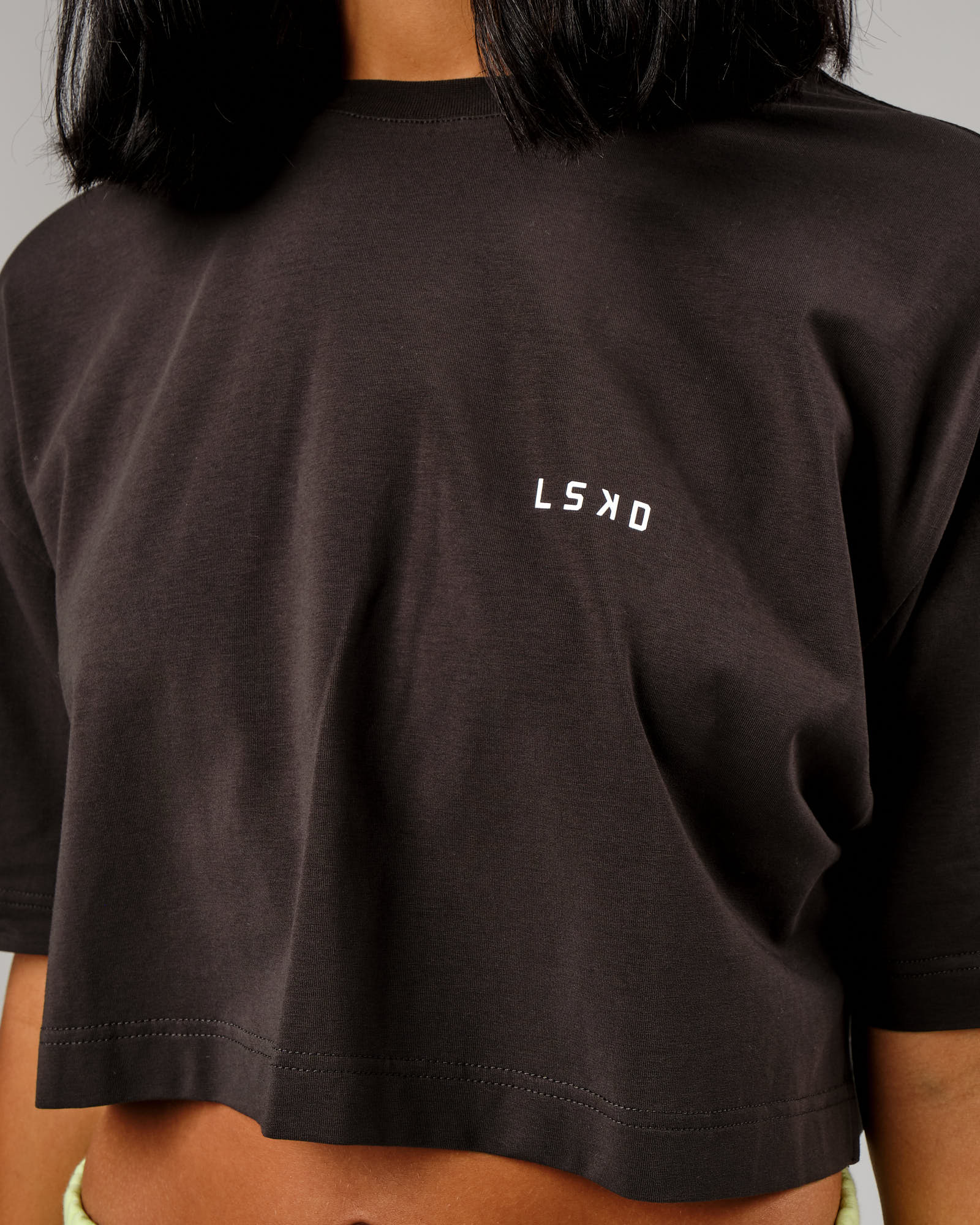 Model wearing Tilt Cropped Tee - Pirate Black