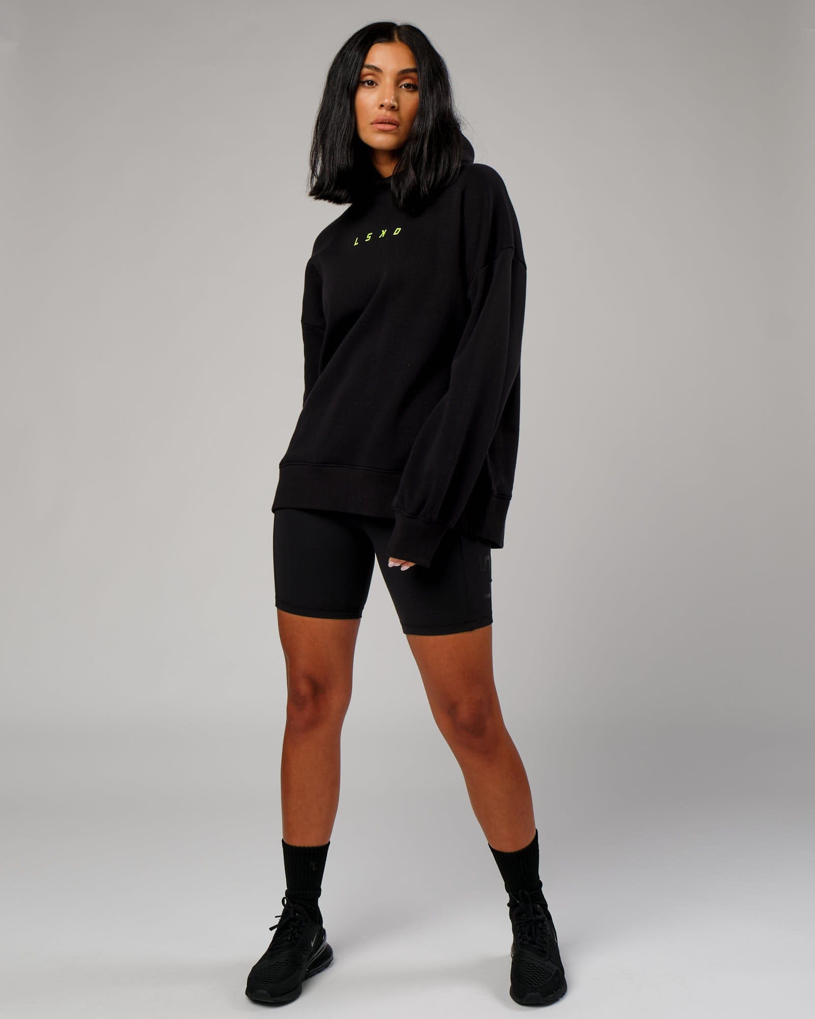 Model wearing Fixed Oversized Hoodie - Black-Fluro Lime