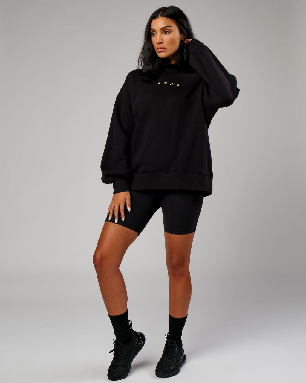 Model wearing Fixed Oversized Hoodie - Black-Fluro Lime