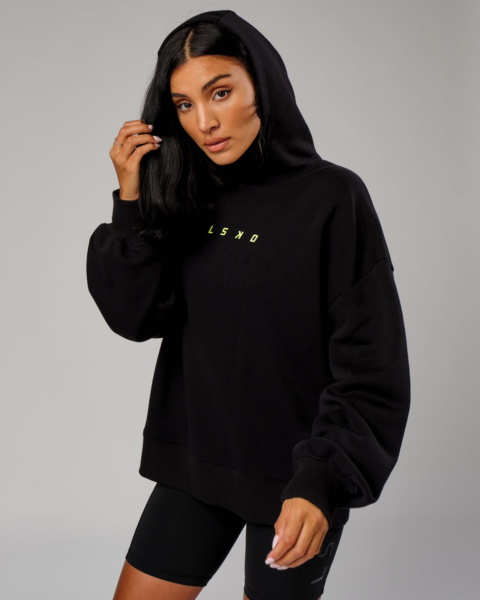 Model wearing Fixed Oversized Hoodie - Black-Fluro Lime