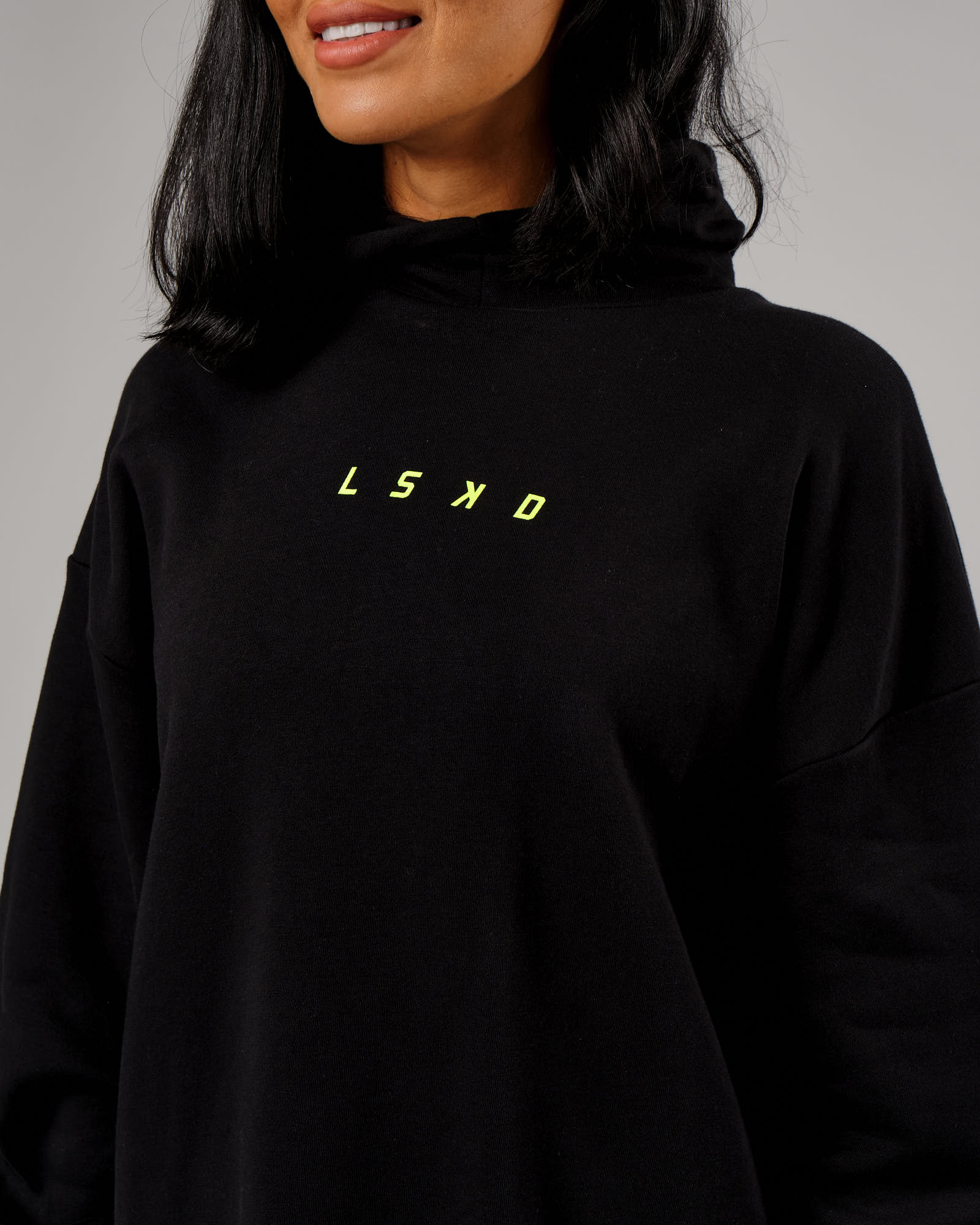 Model wearing Fixed Oversized Hoodie - Black-Fluro Lime