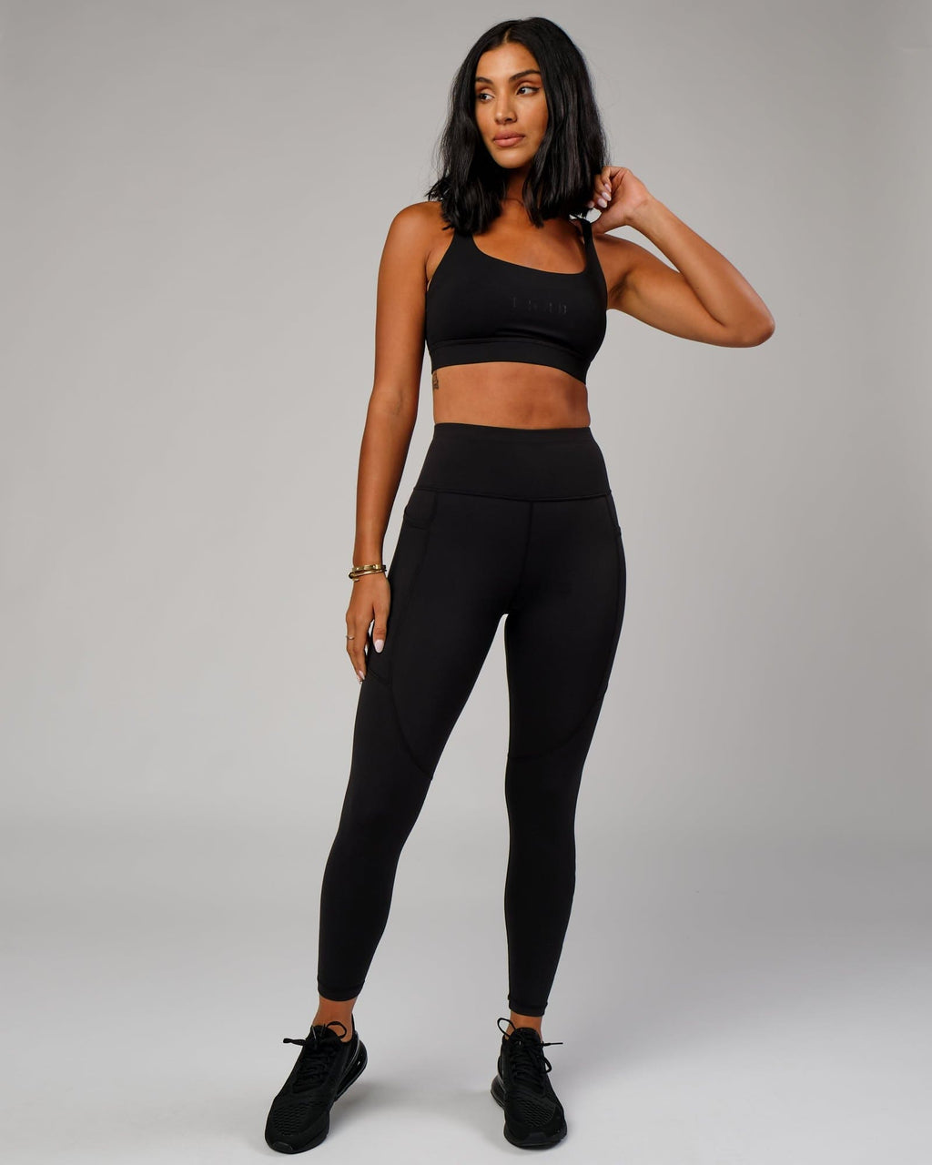 Model wearing Bridge Sports Bra - Black-Black