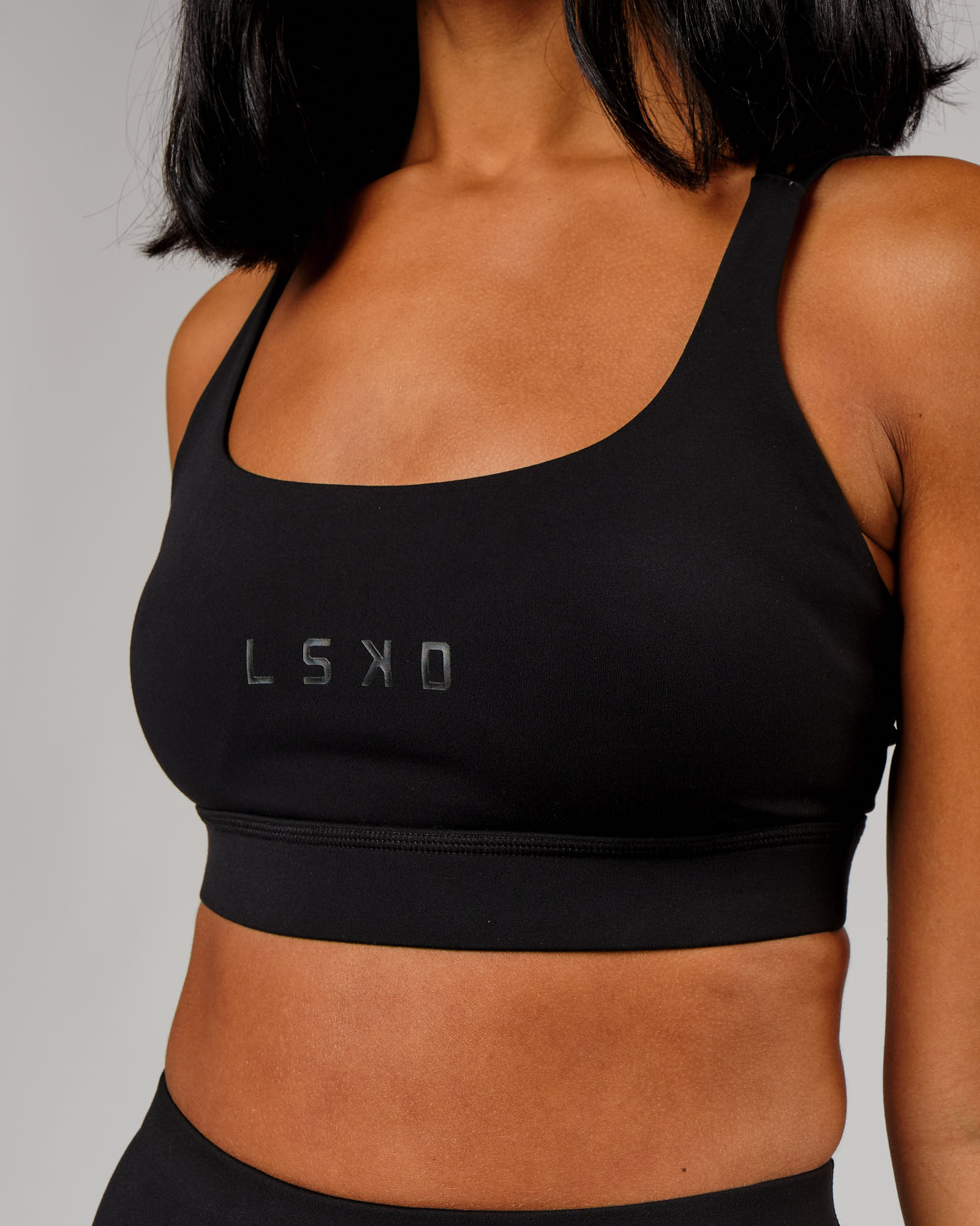 Model wearing Bridge Sports Bra - Black-Black