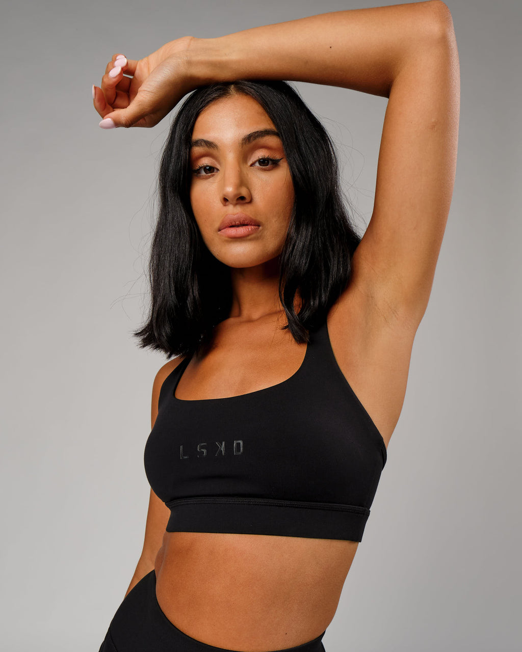 Model wearing Bridge Sports Bra - Black-Black