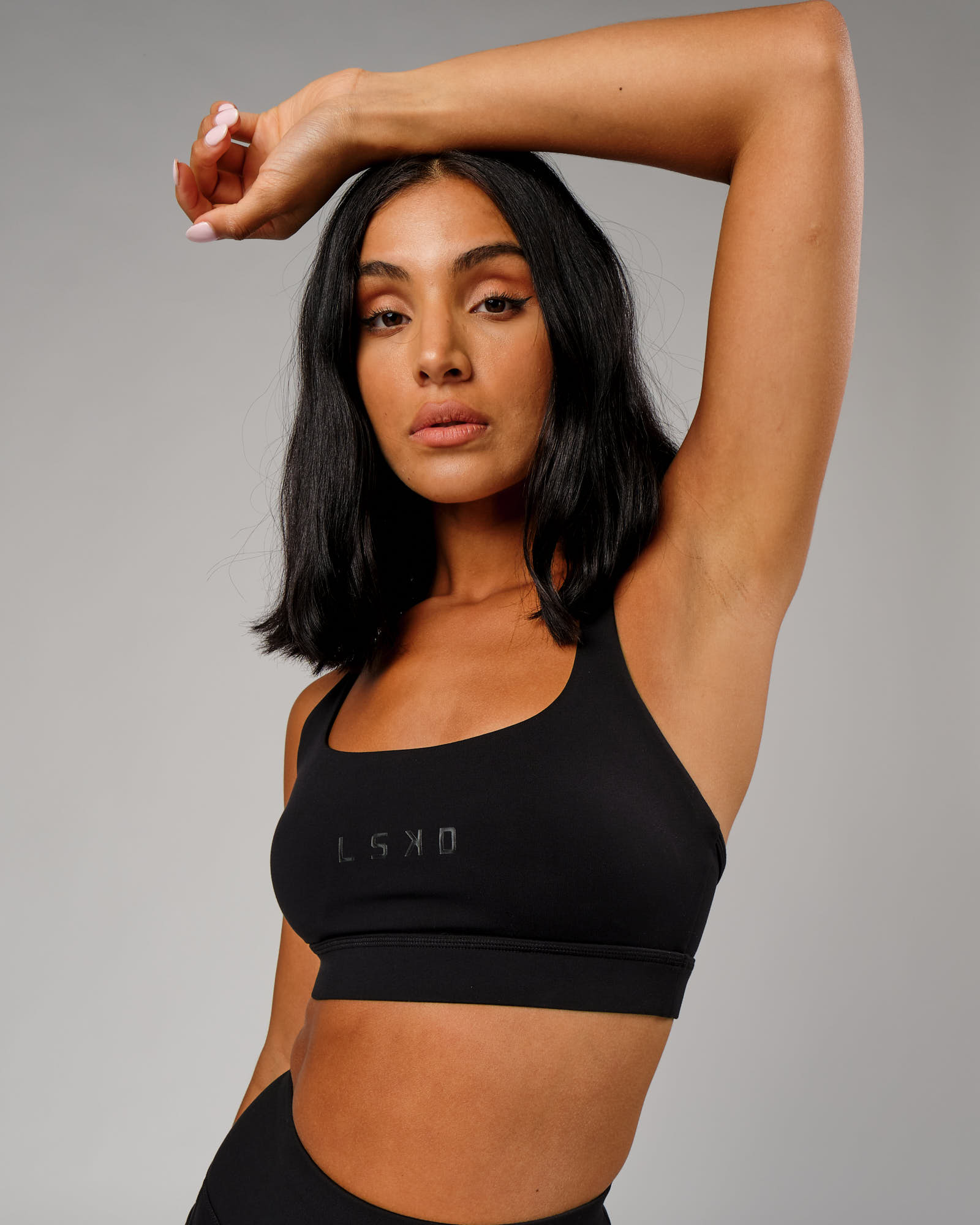 Model wearing Bridge Sports Bra - Black-Black