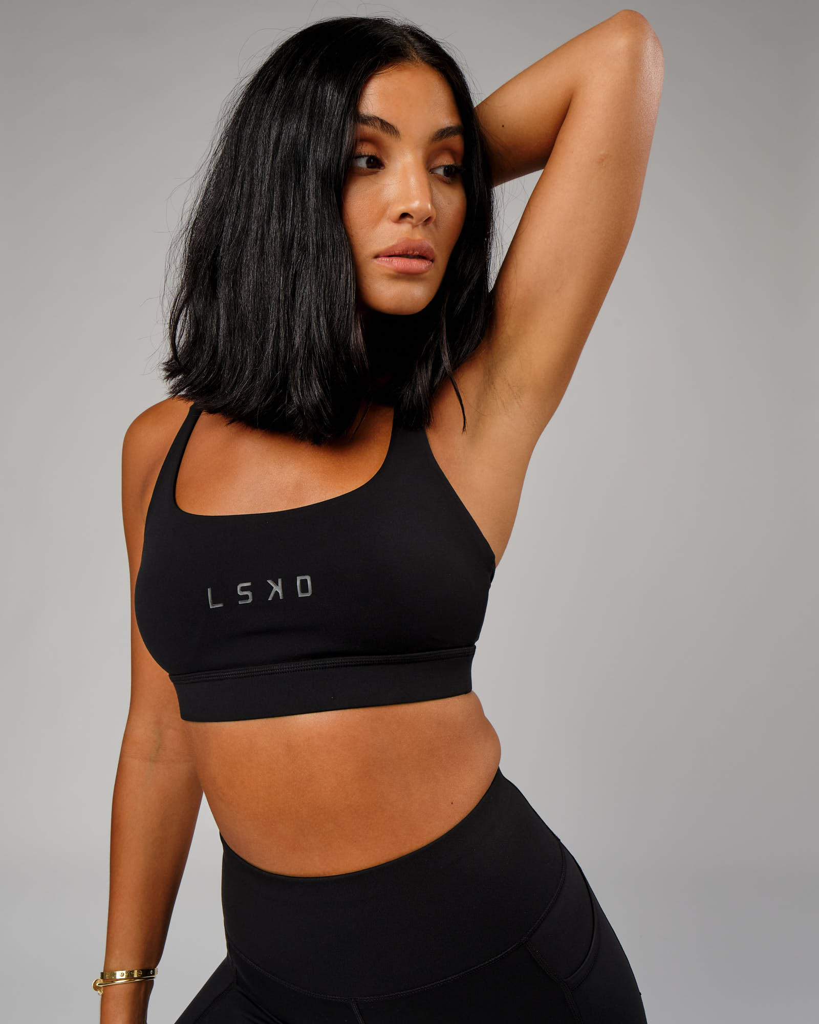 Model wearing Bridge Sports Bra - Black-Black