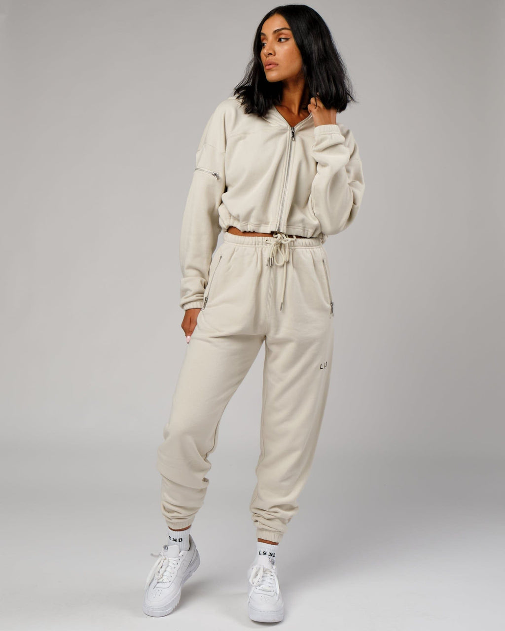 Model wearing Bridge Track Pant - Bone
