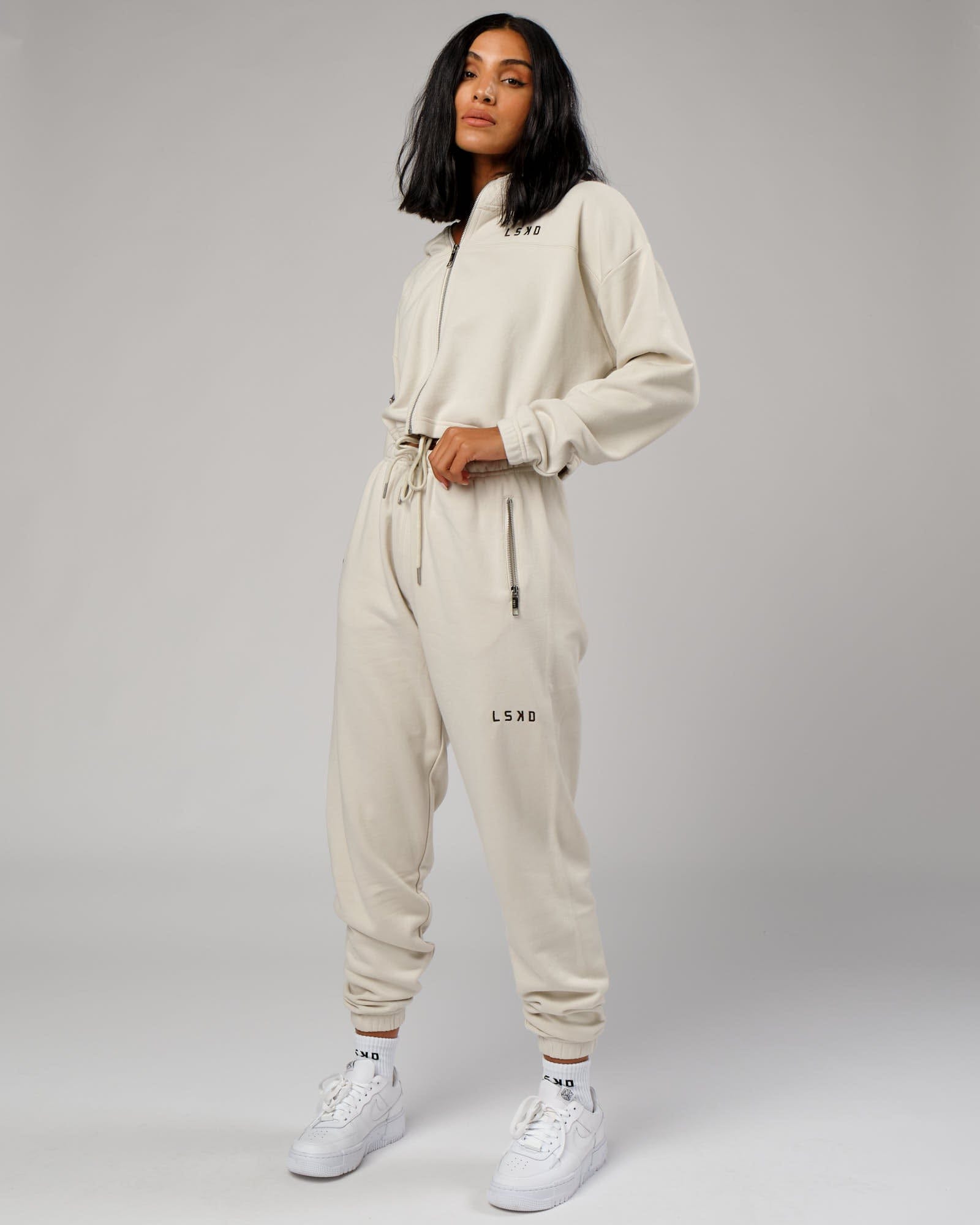 Model wearing Bridge Zip Through Hoodie - Bone