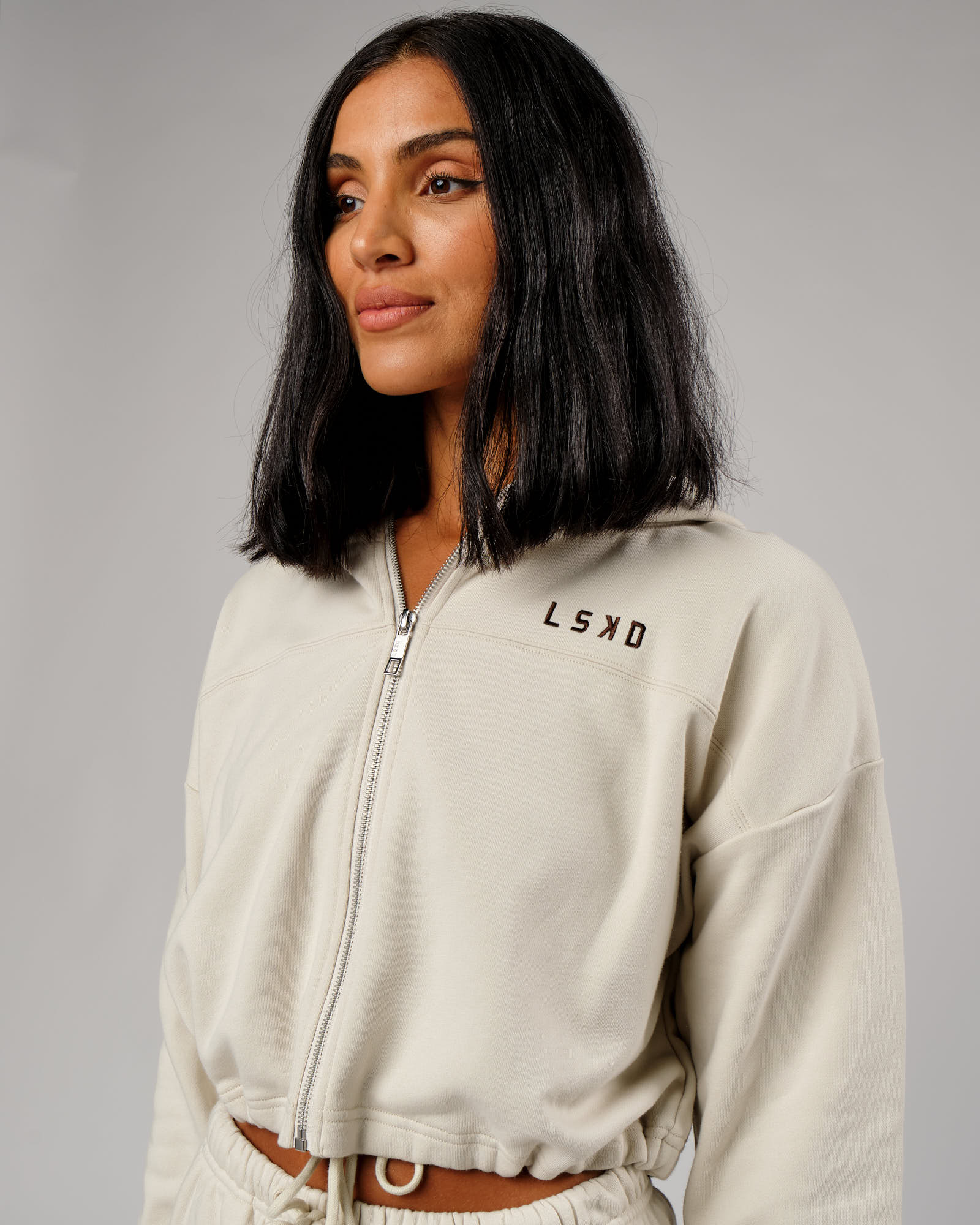 Model wearing Bridge Zip Through Hoodie - Bone