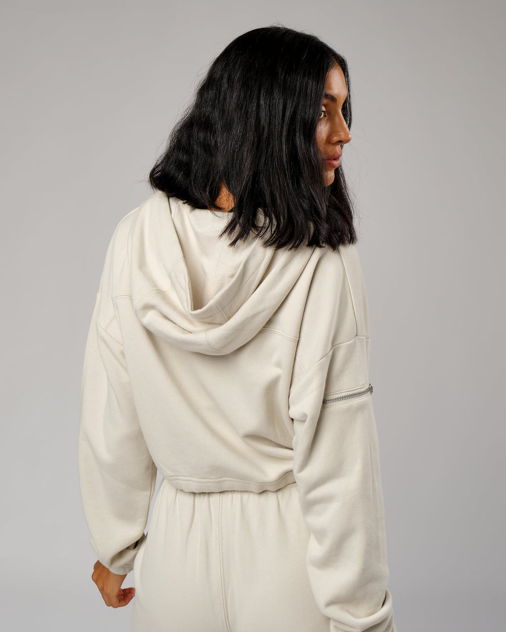 Model wearing Bridge Zip Through Hoodie - Bone