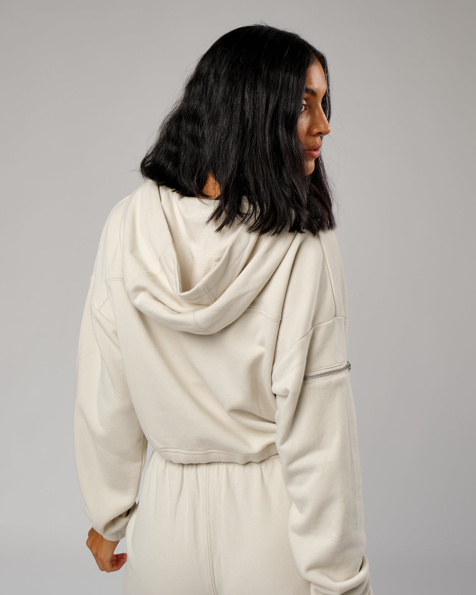 Model wearing Bridge Zip Through Hoodie - Bone