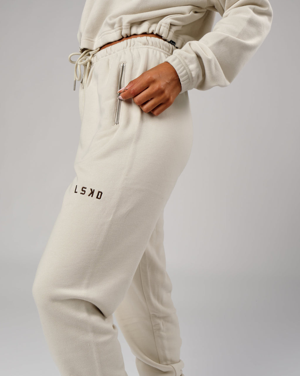 Model wearing Bridge Track Pant - Bone