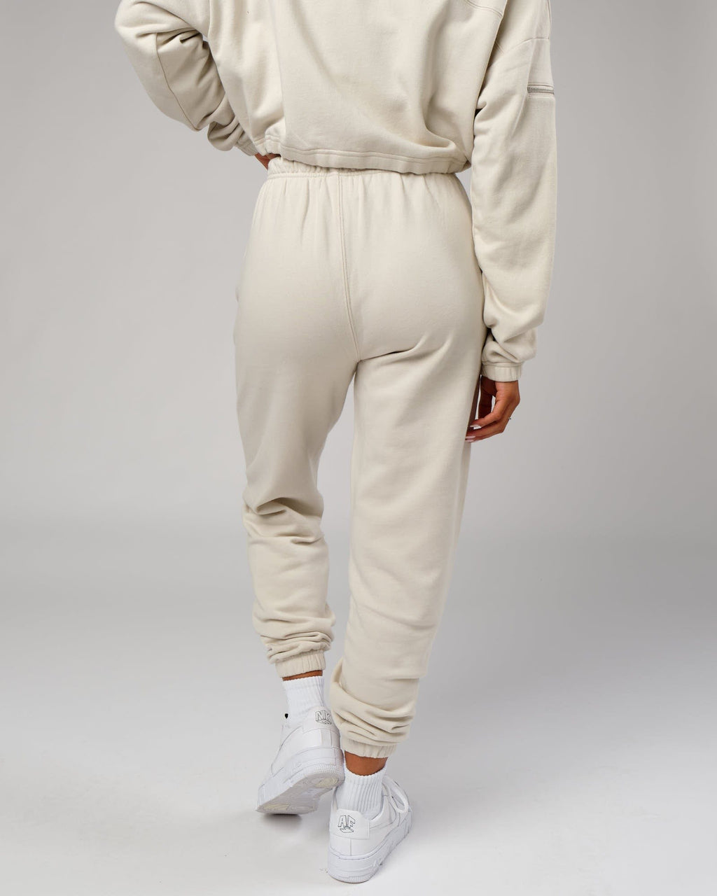 Model wearing Bridge Track Pant - Bone
