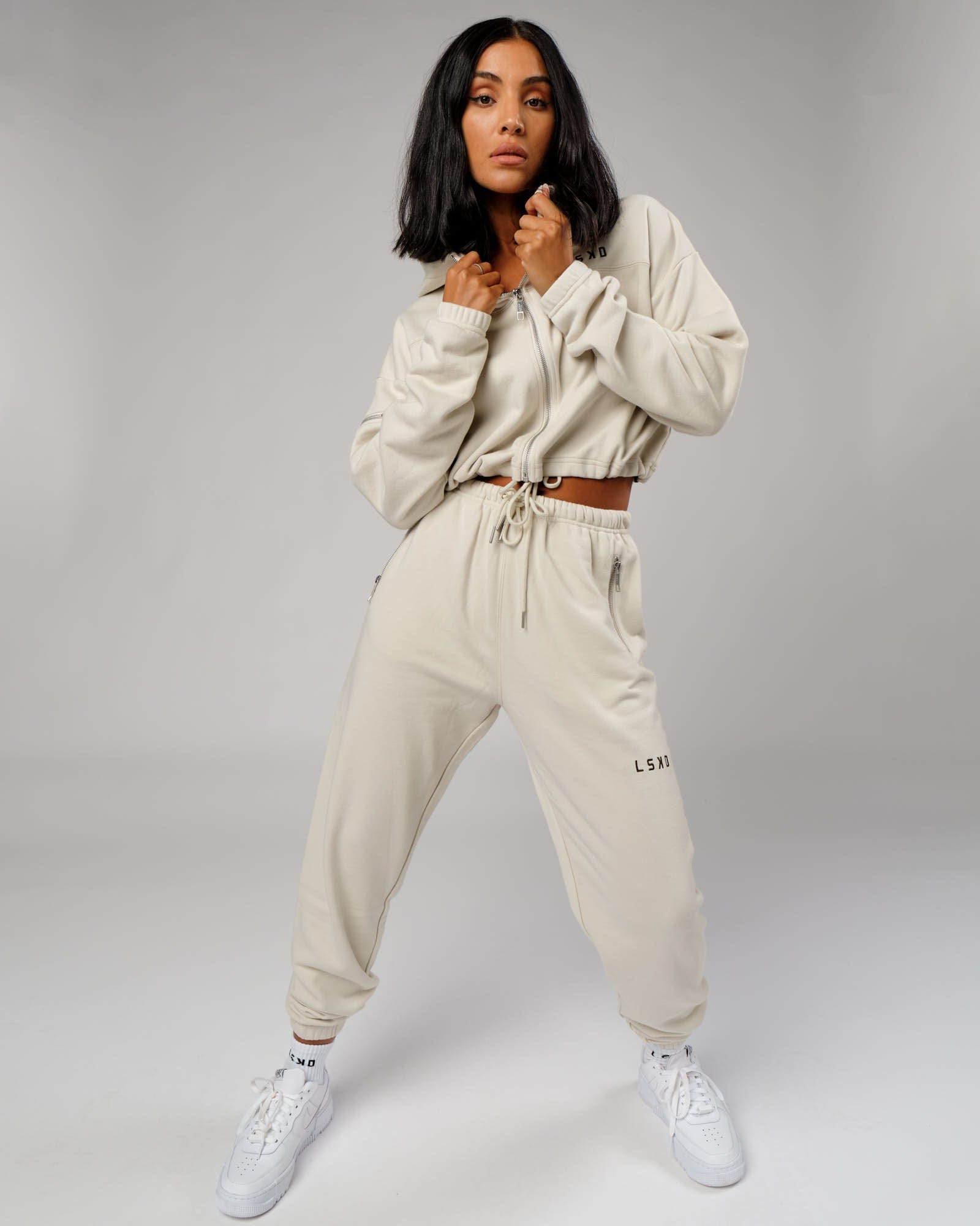 Model wearing Bridge Track Pant - Bone