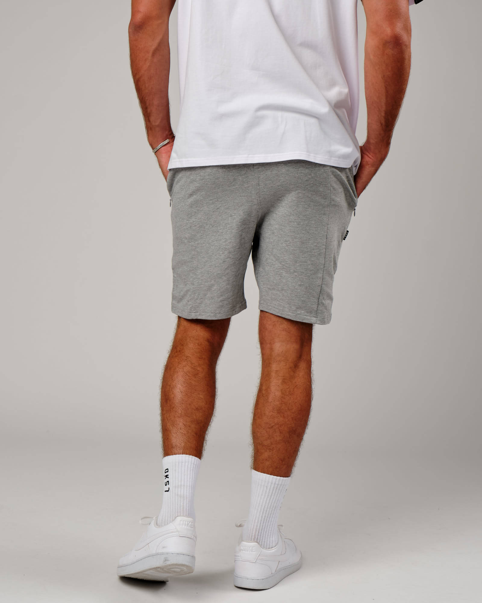 Model wearing Vitality Short - Lt Grey Marl