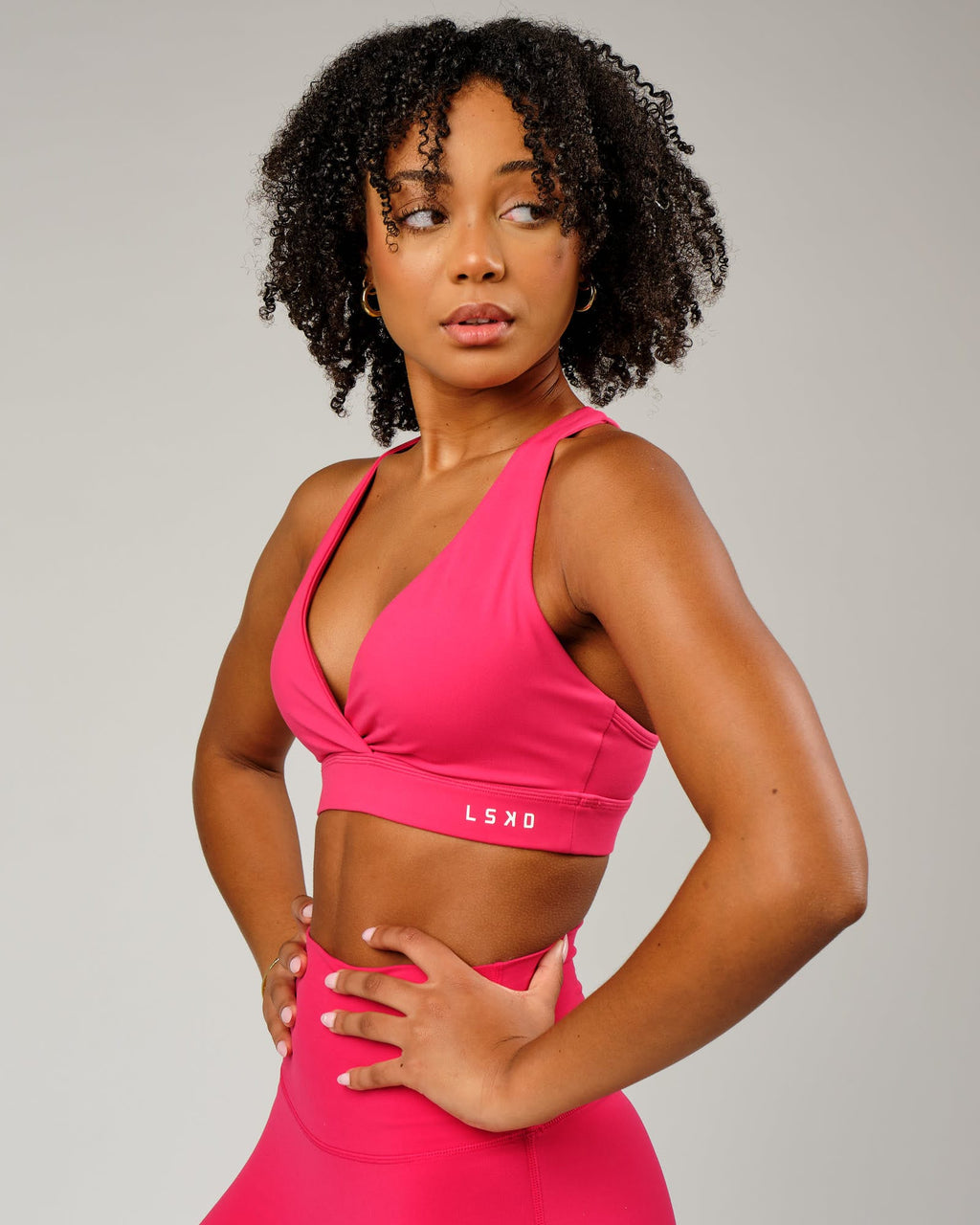 Model wearing Ignite Sports Bra - Boysenberry