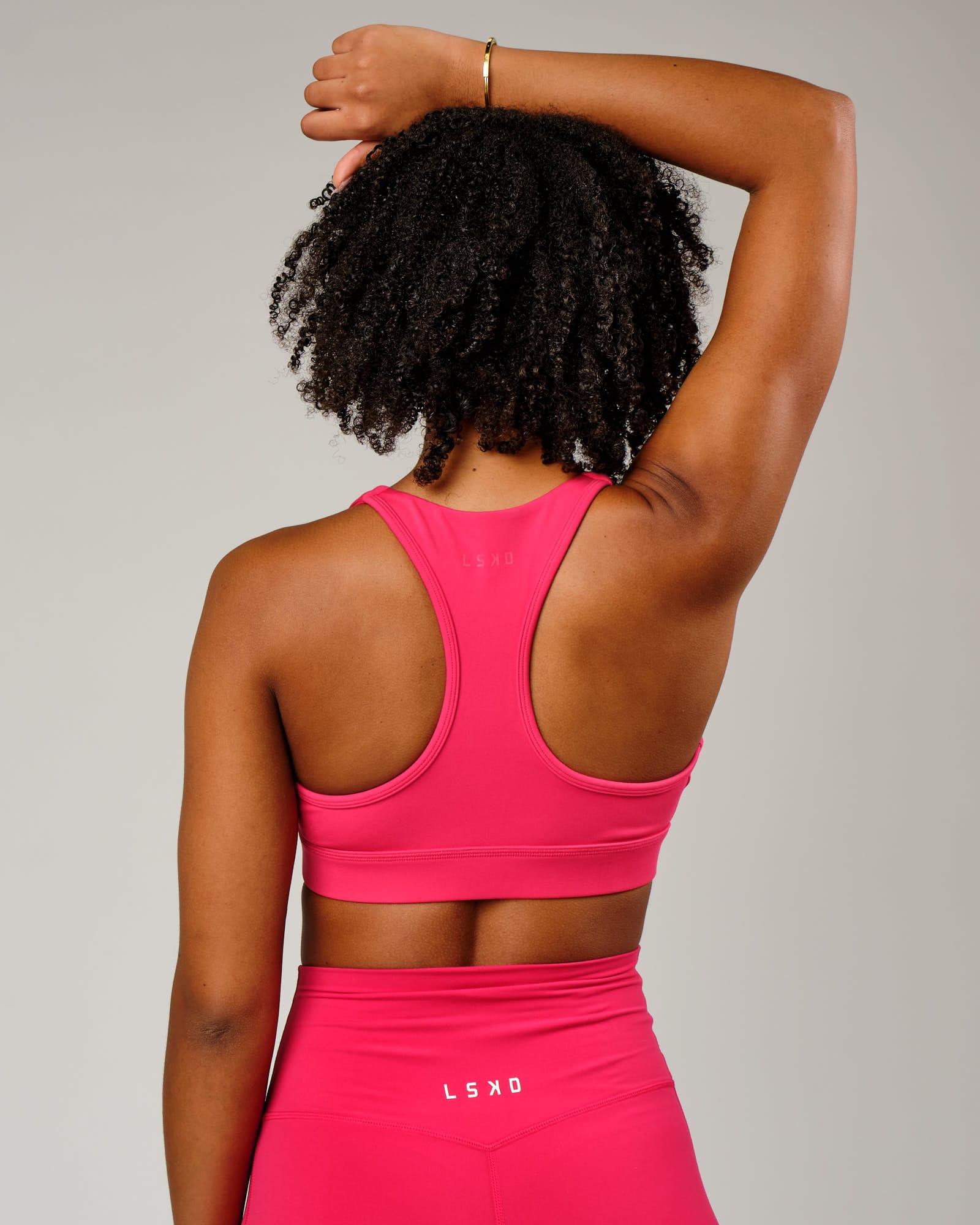 Model wearing Ignite Sports Bra - Boysenberry