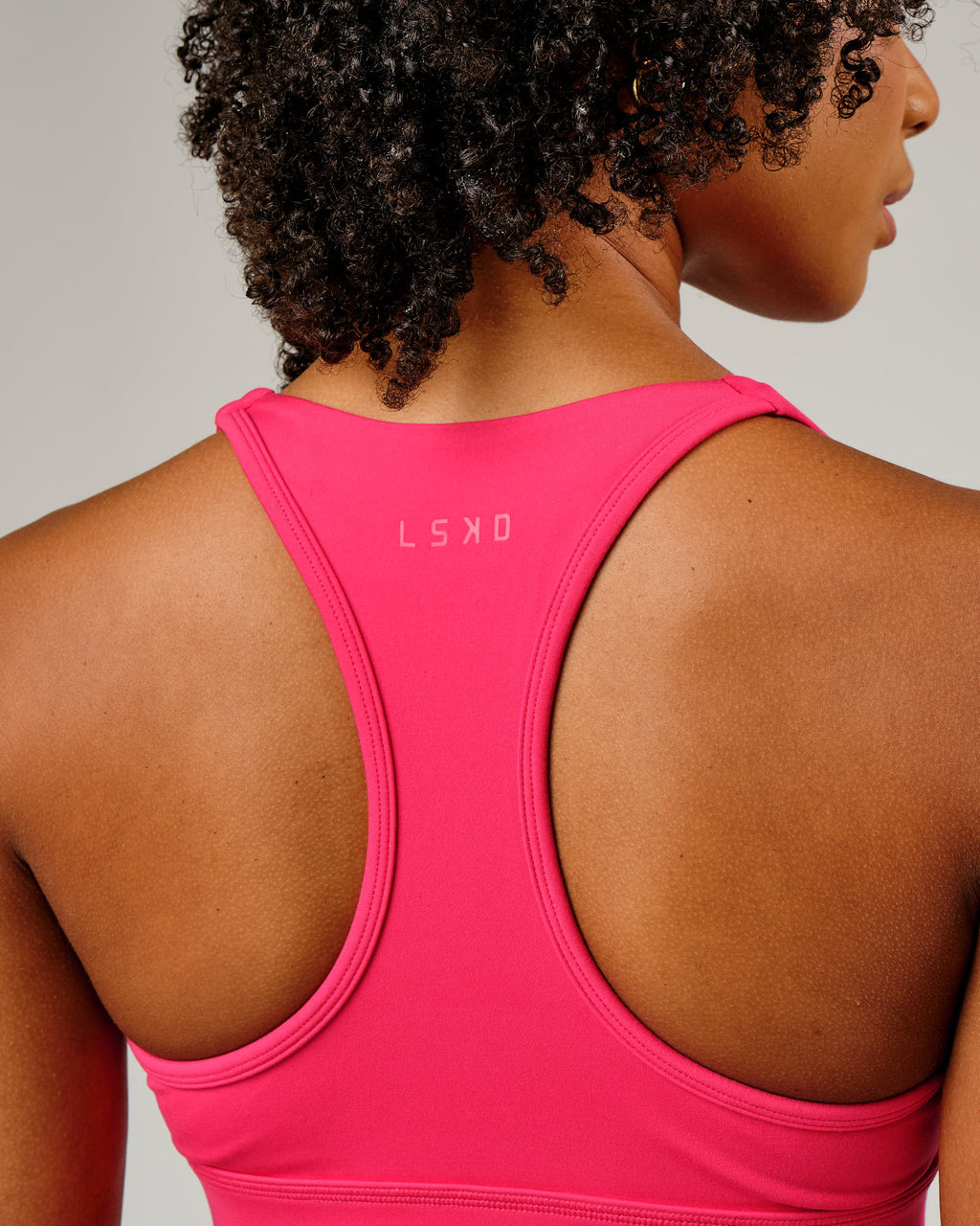 Model wearing Ignite Sports Bra - Boysenberry