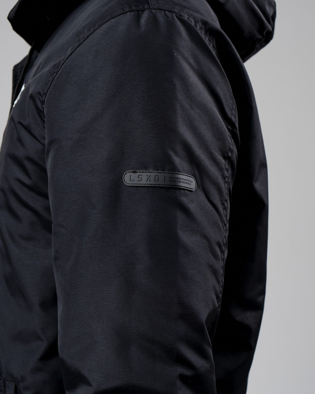 Model wearing Unisex Tack Anorak Jacket - Black