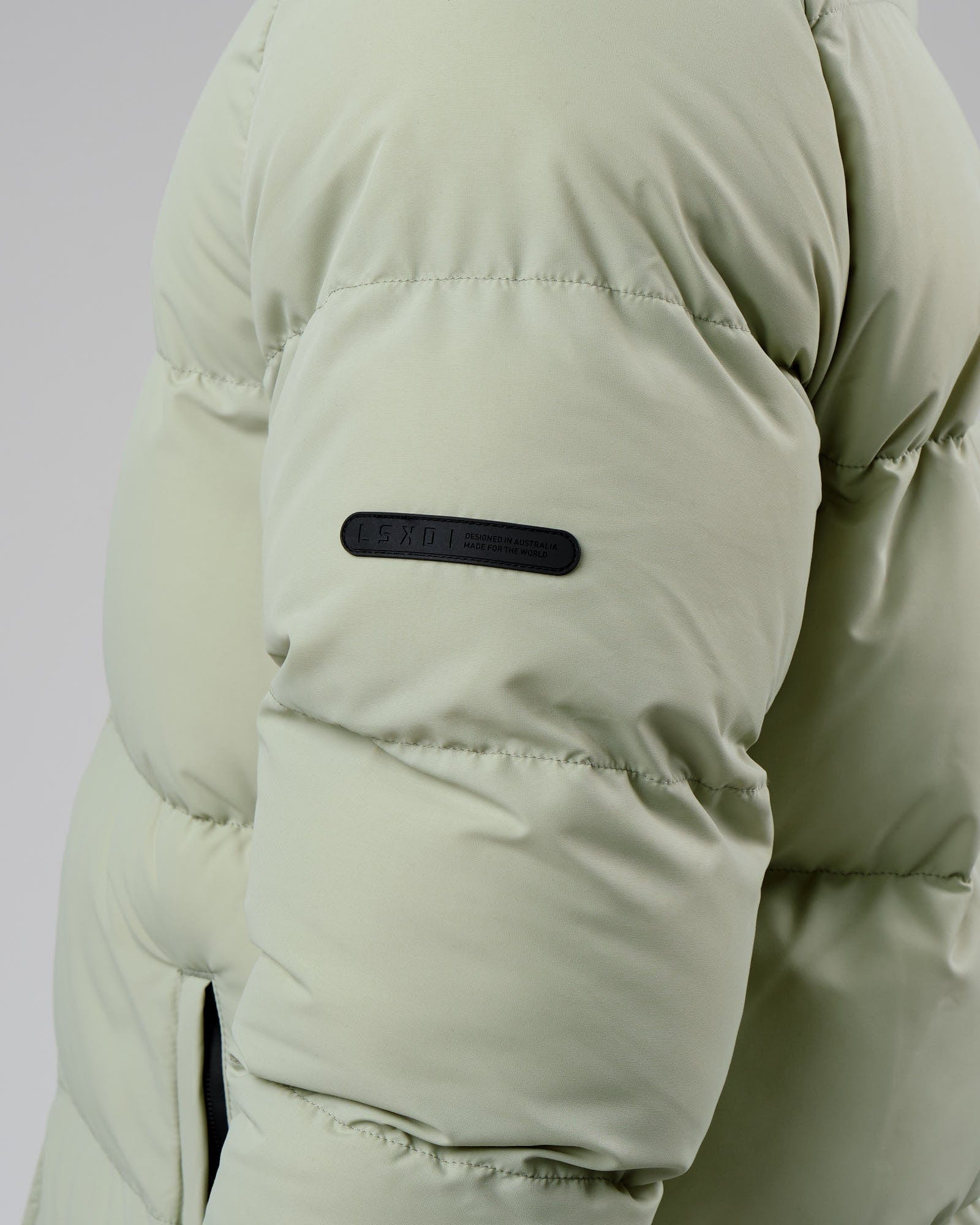 Model wearing Unisex Roasted Puffer Jacket Oversize 22 - Desert Sage