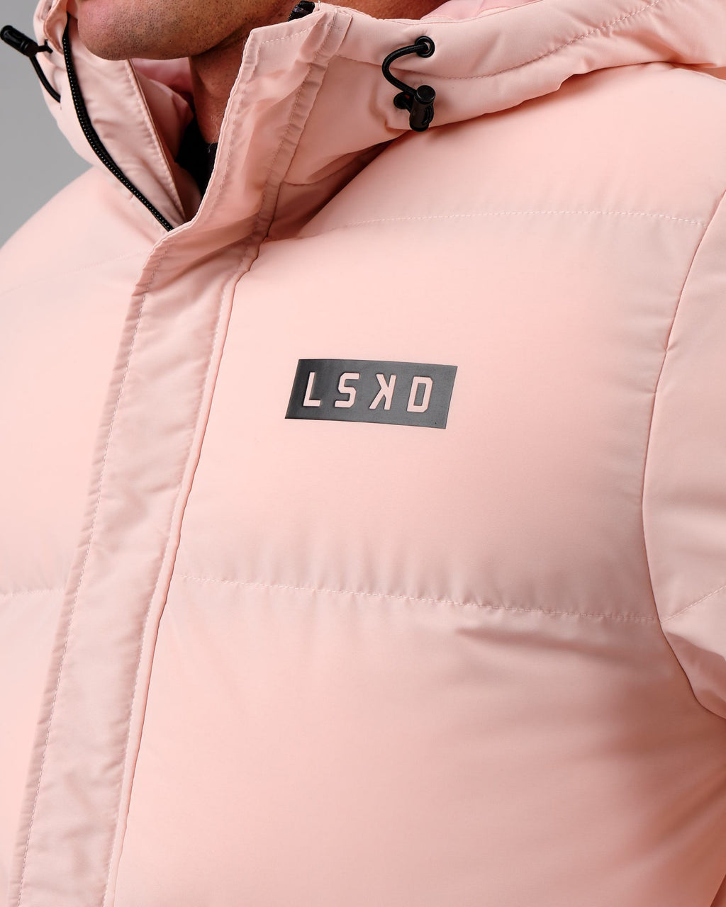 Model wearing Unisex Roasted Puffer Jacket Oversize 22 - Peach Whip