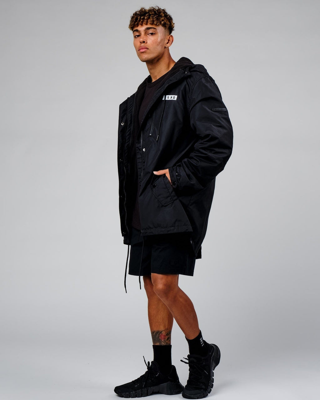 Model wearing Tack Anorak Jacket - Black