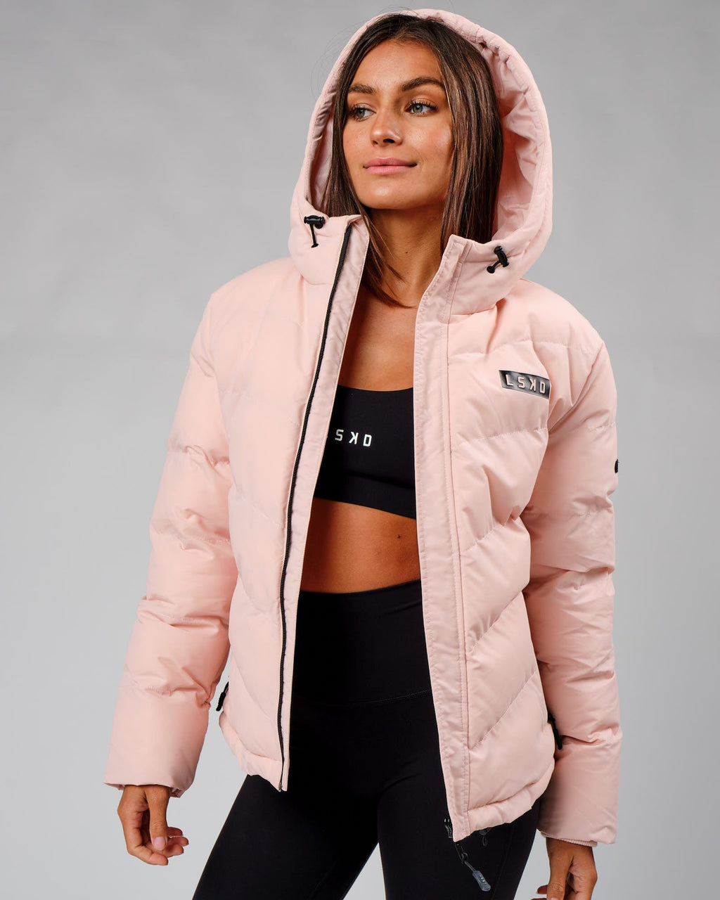 Model wearing Roasted Puffer Jacket 22 - Peach Whip