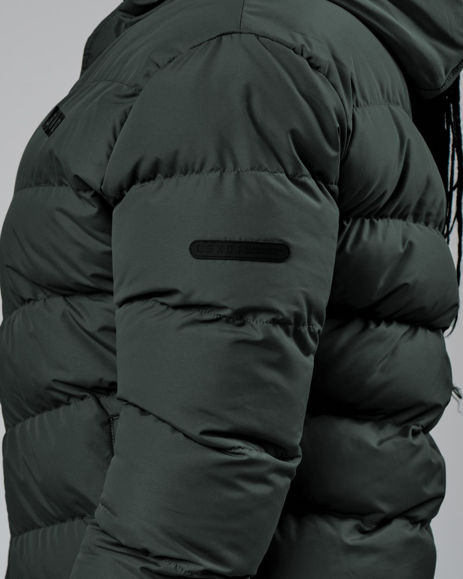 Model wearing Roasted Puffer Jacket 22 - Carbon Green
