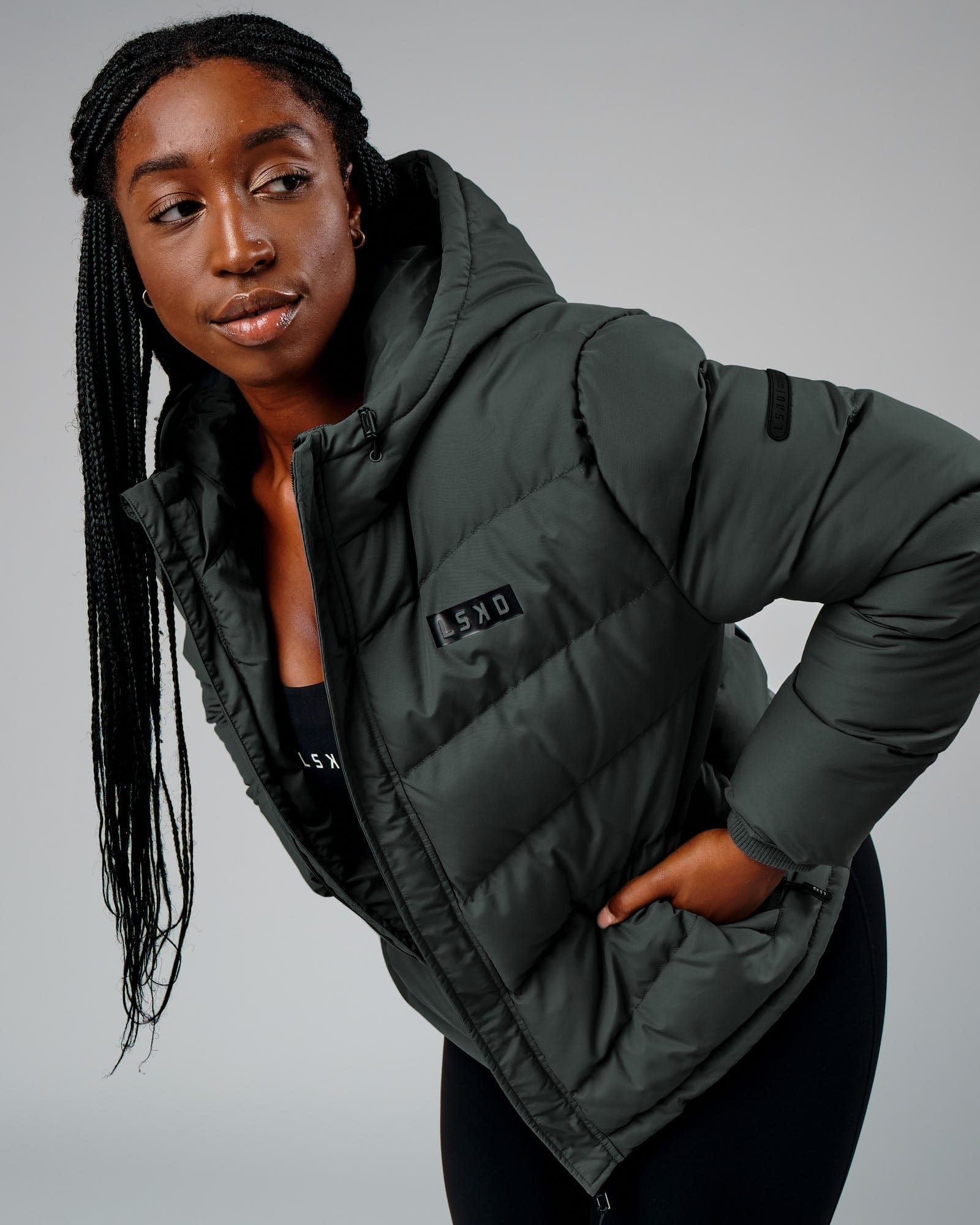 Model wearing Roasted Puffer Jacket 22 - Carbon Green