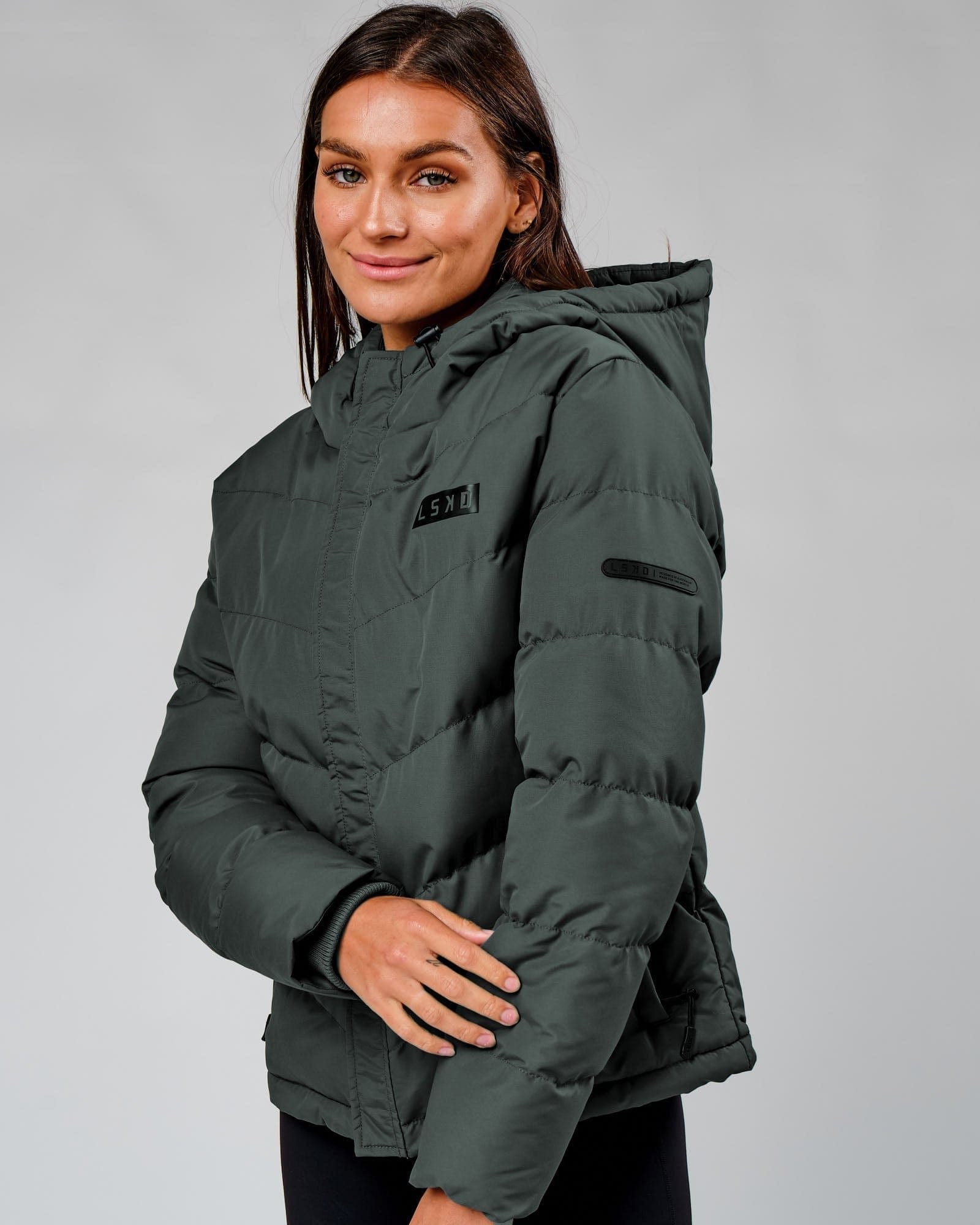 Model wearing Roasted Puffer Jacket 22 - Carbon Green