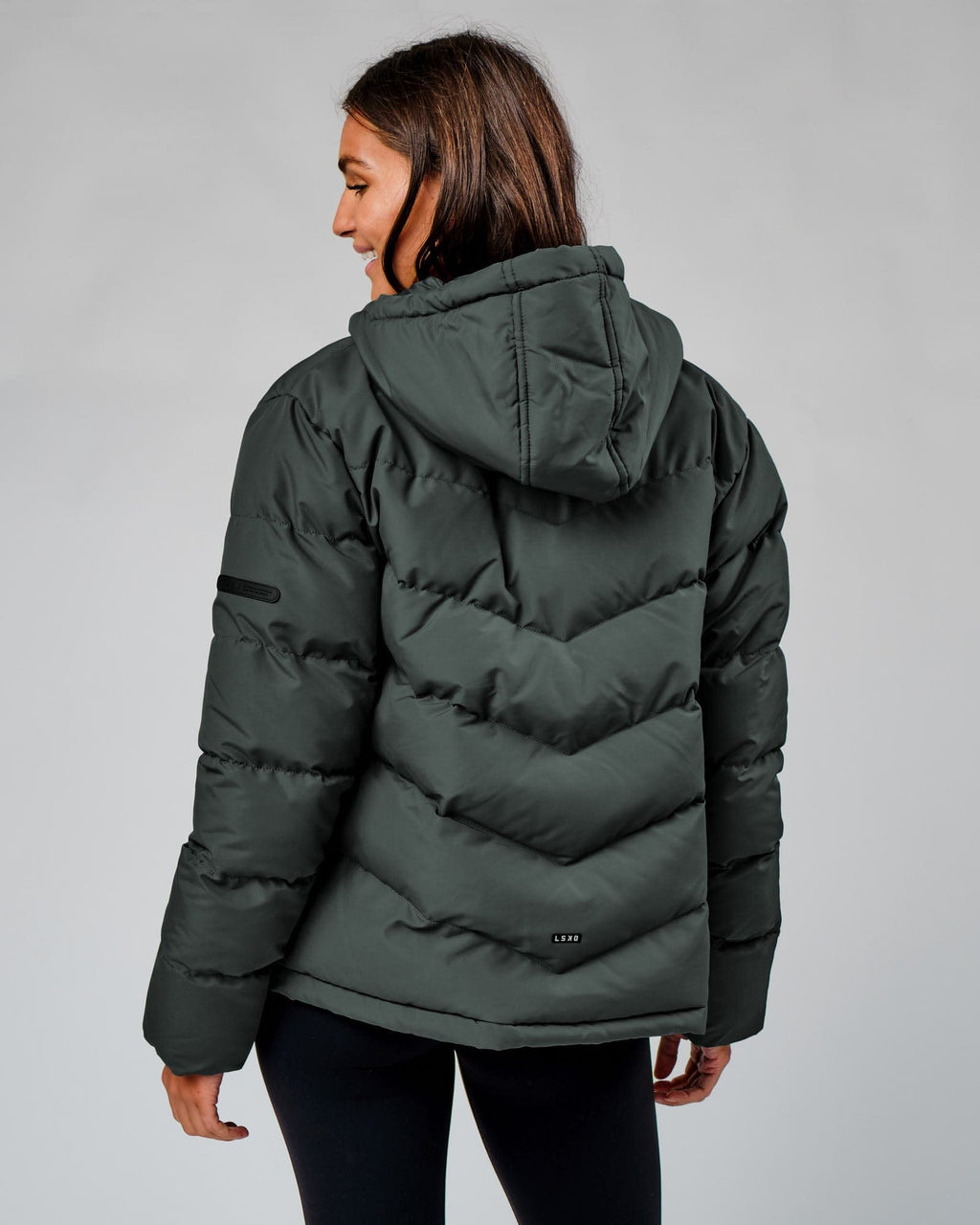 Model wearing Roasted Puffer Jacket 22 - Carbon Green