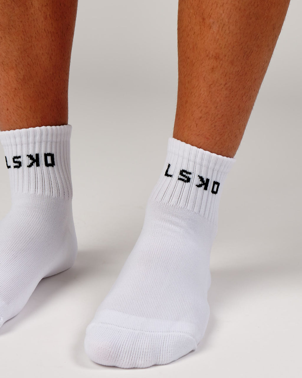Model wearing Base Quarter Sock - White