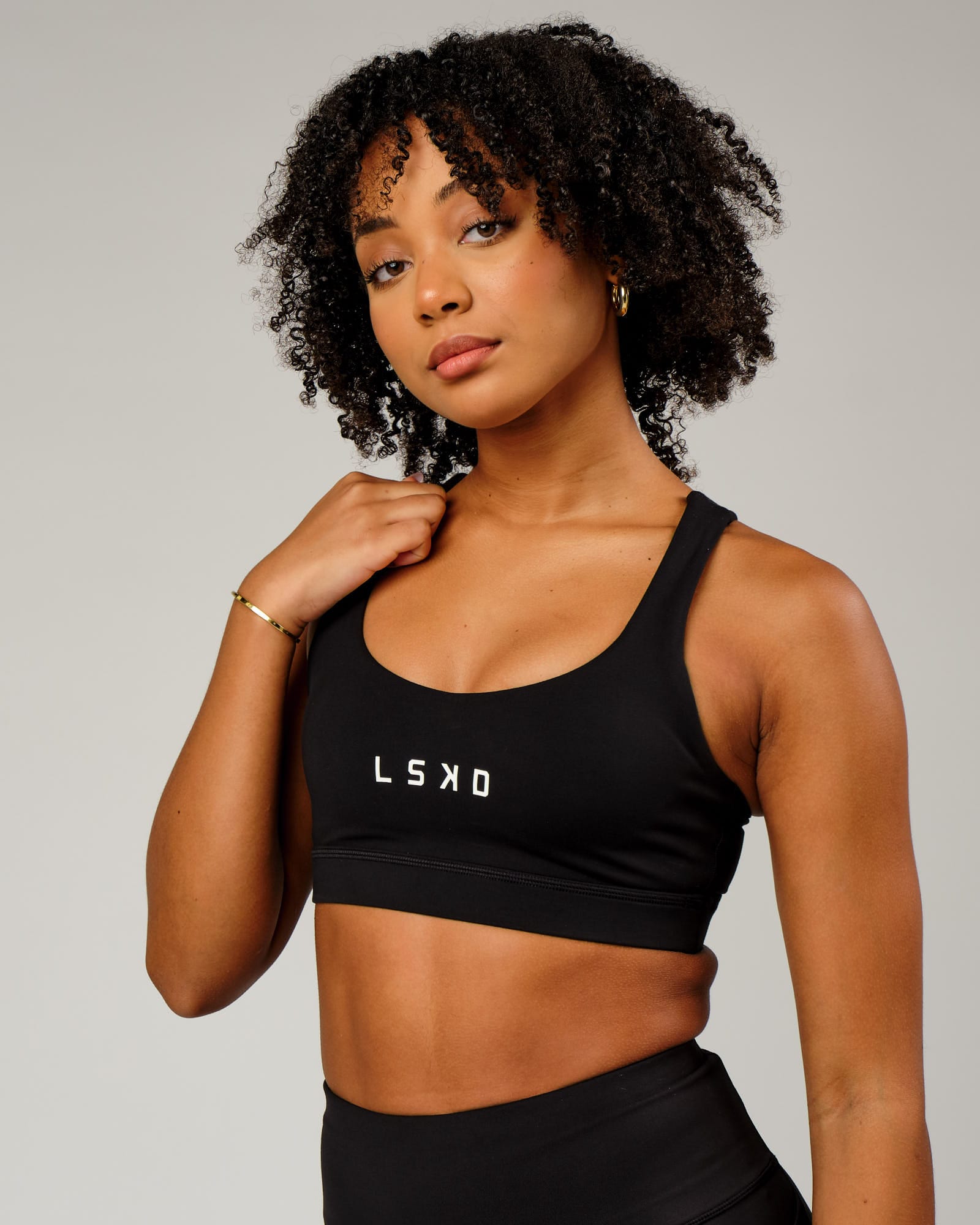 Model wearing Rep Sports Bra Small Logo - Black-White