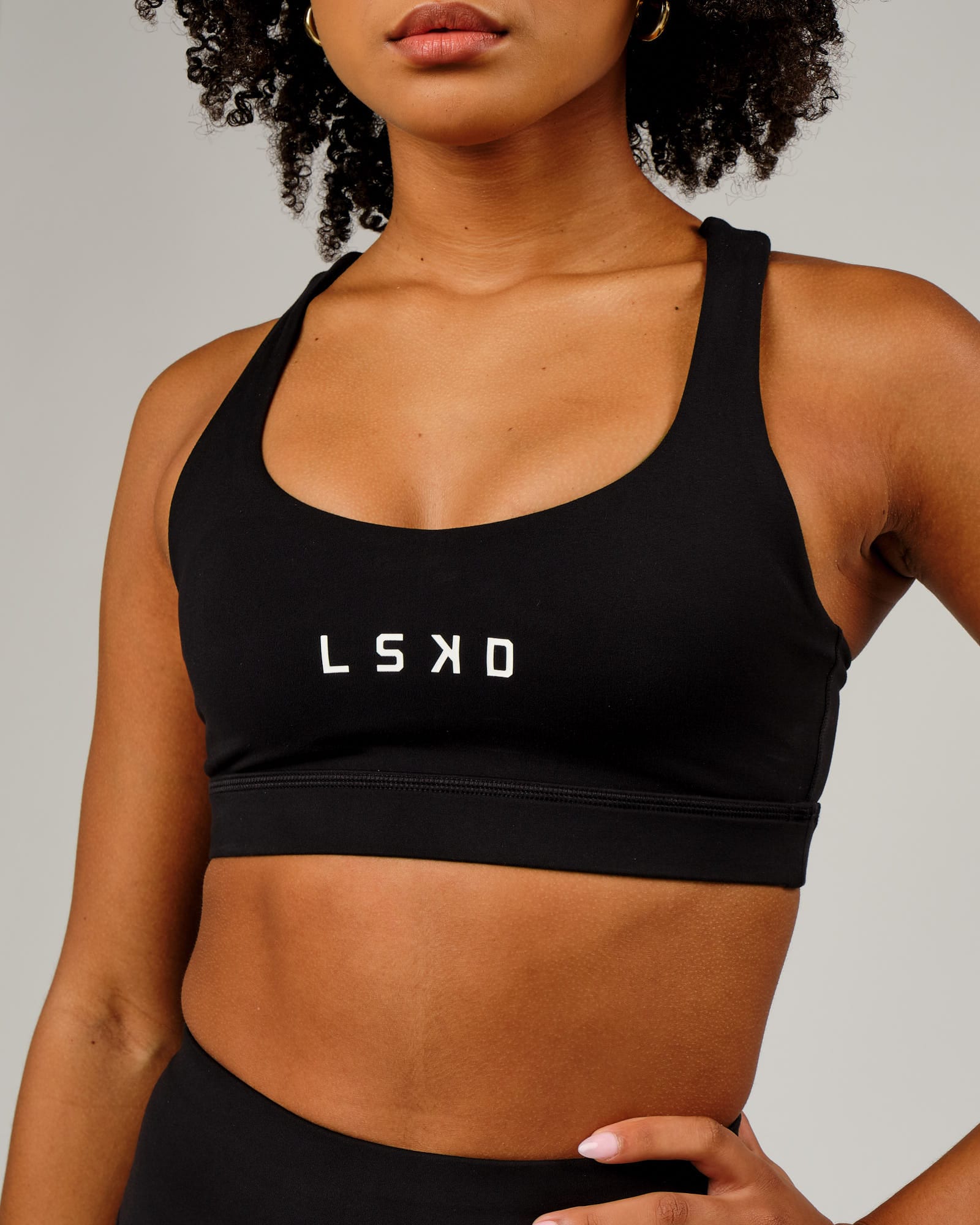 Model wearing Rep Sports Bra Small Logo - Black-White