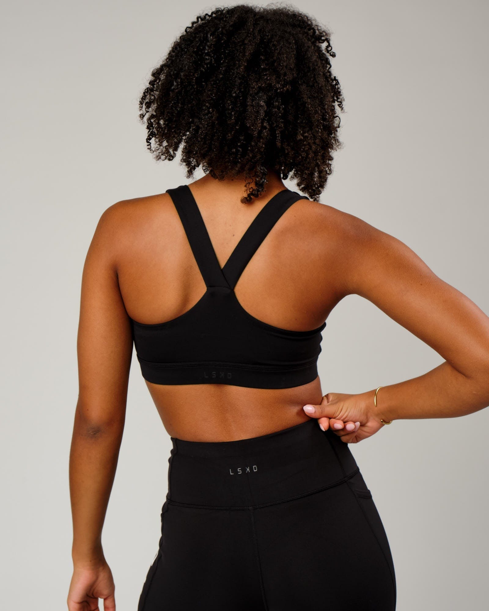 Model wearing Rep Sports Bra Small Logo - Black-White