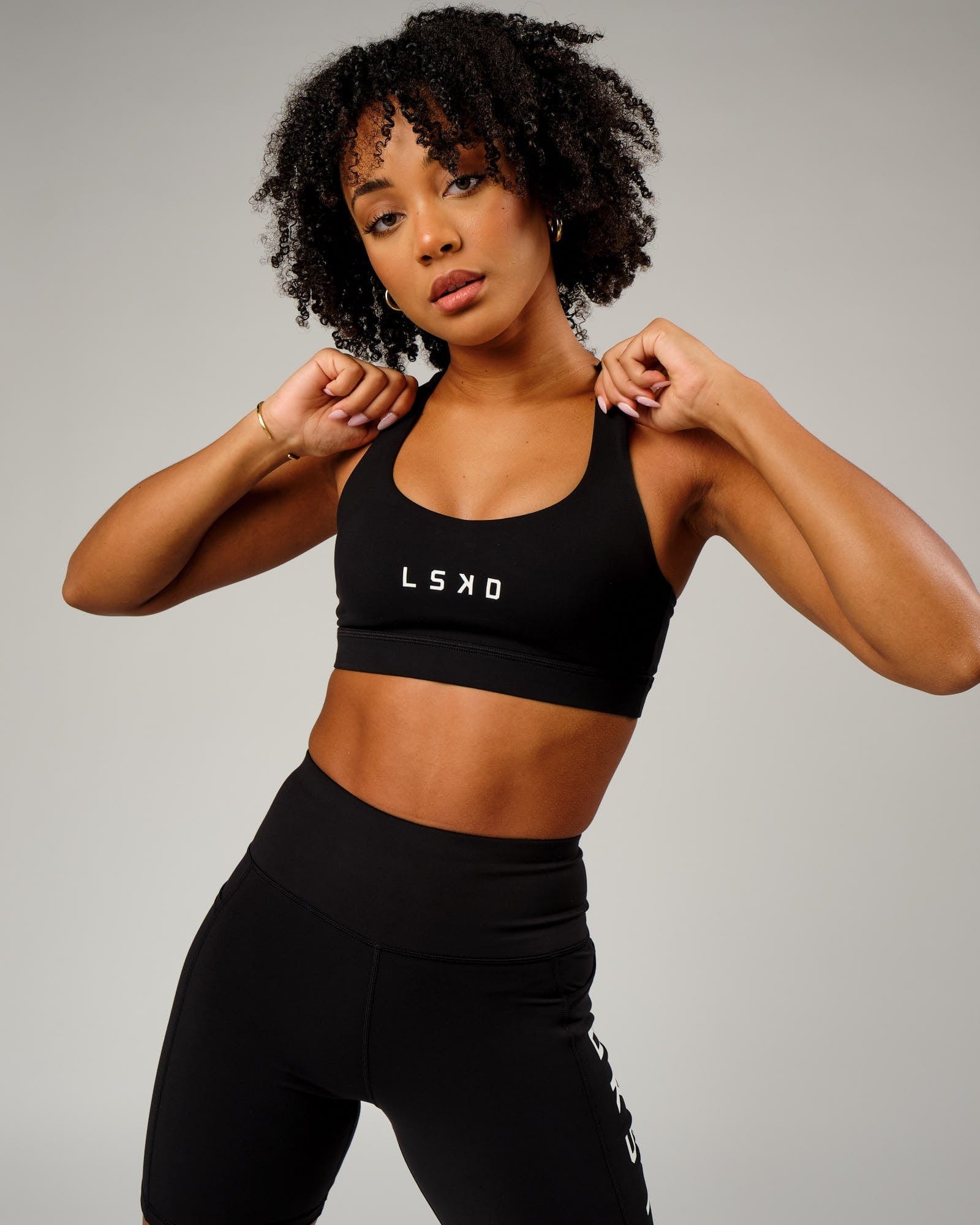 Model wearing Rep Sports Bra Small Logo - Black-White